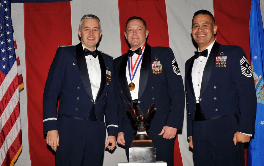 MOODY AIR FORCE BASE, Ga. -- Senior Master Sgt. Terry Webb Sr., 23rd Wing 2008 Senior Noncommissioned Officer of the Year Award winner, poses for a photo with (left) Col. Kenneth Todorov, 23rd Wing commander and (right) Chief Master Sgt. Paul Burgess, 23rd Wing command chief, during the 2008 Annual Awards Ceremony held at the James H. Rainwater Conference Center Jan. 31. (U.S. Air Force photo by Senior Airman Schelli Jones) 