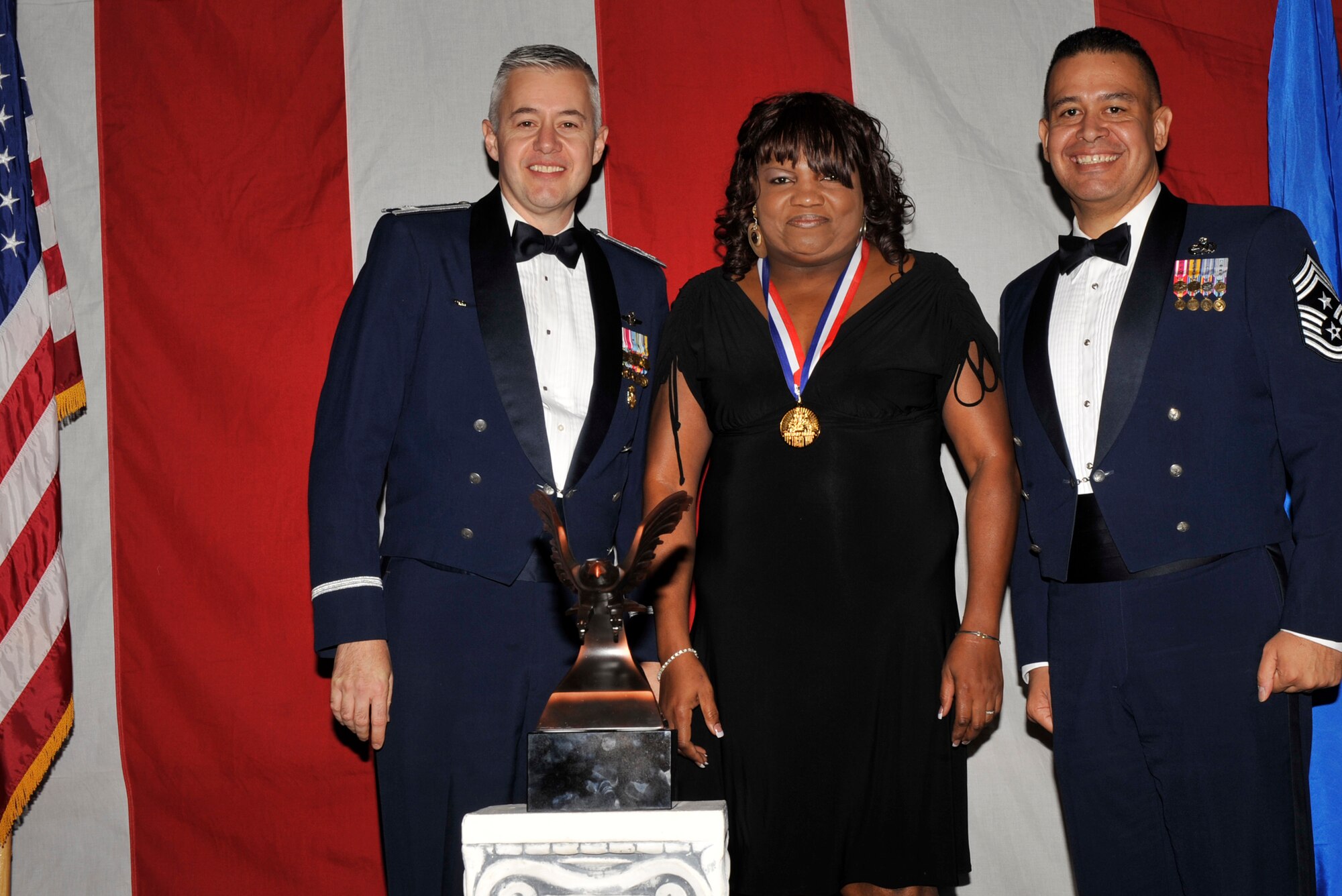 MOODY AIR FORCE BASE, Ga. -- Ida Mays, 23rd Wing 2008 Civilian of the Year Non-Appropriated Funds Non-Supervisor Award winner, poses for a photo with (left) Col. Kenneth Todorov, 23rd Wing commander and (right) Chief Master Sgt. Paul Burgess, 23rd Wing command chief, during the 2008 Annual Awards Ceremony held at the James H. Rainwater Conference Center Jan. 31. (U.S. Air Force photo by Senior Airman Schelli Jones)