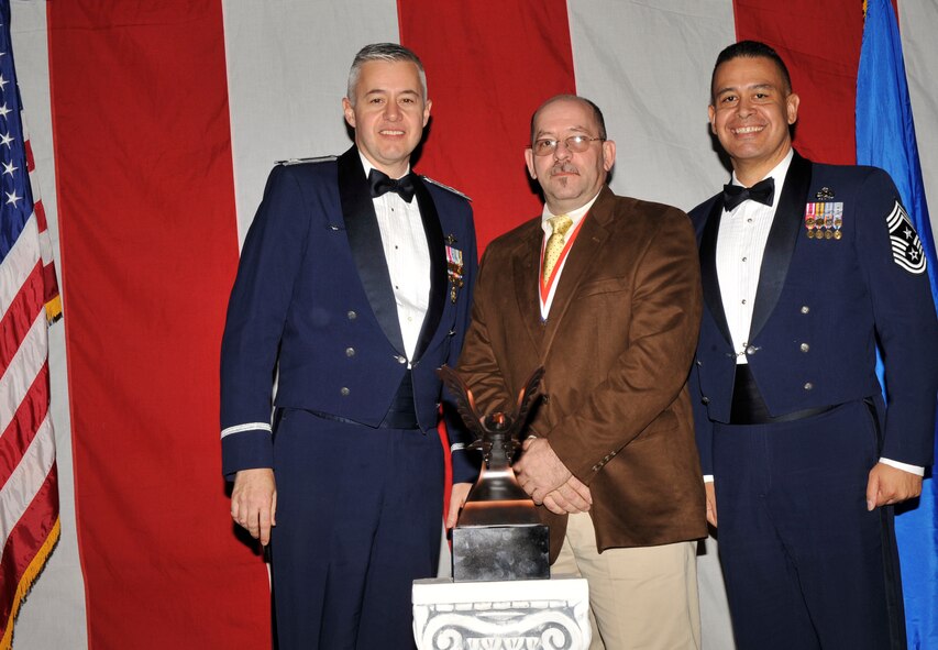 MOODY AIR FORCE BASE, Ga. -- Jose Hernandez, 23rd Wing 2008 Civilian of the Year Wage Grade Award winner, poses for a photo with (left) Col. Kenneth Todorov, 23rd Wing commander and (right) Chief Master Sgt. Paul Burgess, 23rd Wing command chief, during the 2008 Annual Awards Ceremony held at the James H. Rainwater Conference Center Jan. 31. (U.S. Air Force photo by Senior Airman Schelli Jones)
