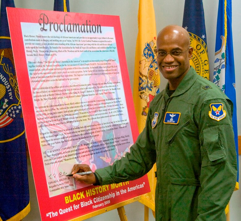 45th Space Wing Commander Brig. Gen. Edward L. Bolton, Jr., signs the 2009 Black History Month Proclamation at the Professional Development Center Feb. 2. (U.S. Air Force photo by John Connell)