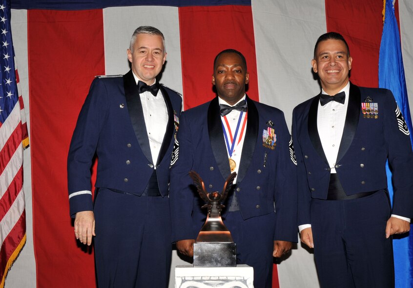 MOODY AIR FORCE BASE, Ga. -- Senior Master Sgt. Gregory Brown, 23rd Wing 2008 First Sergeant of the Year Award winner, poses for a photo with (left) Col. Kenneth Todorov, 23rd Wing commander and (right) Chief Master Sgt. Paul Burgess, 23rd Wing command chief, during the 2008 Annual Awards Ceremony held at the James H. Rainwater Conference Center Jan. 31. (U.S. Air Force photo by Senior Airman Schelli Jones) 