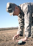 Airman Matthew Desrochers, an Explosive Ordnance Disposal Preliminary Course student with the 342nd Training Squadron, carefully prepares a block of C-4 for detonation during training at the EOD proficiency range on Lackland's Training Annex. The six-day EOD proficiency course teaches ordnance familiarization and screens students for entry into the seven-month technical school at Eglin Air Force Base, Fla. (USAF photo by Robbin Cresswell)