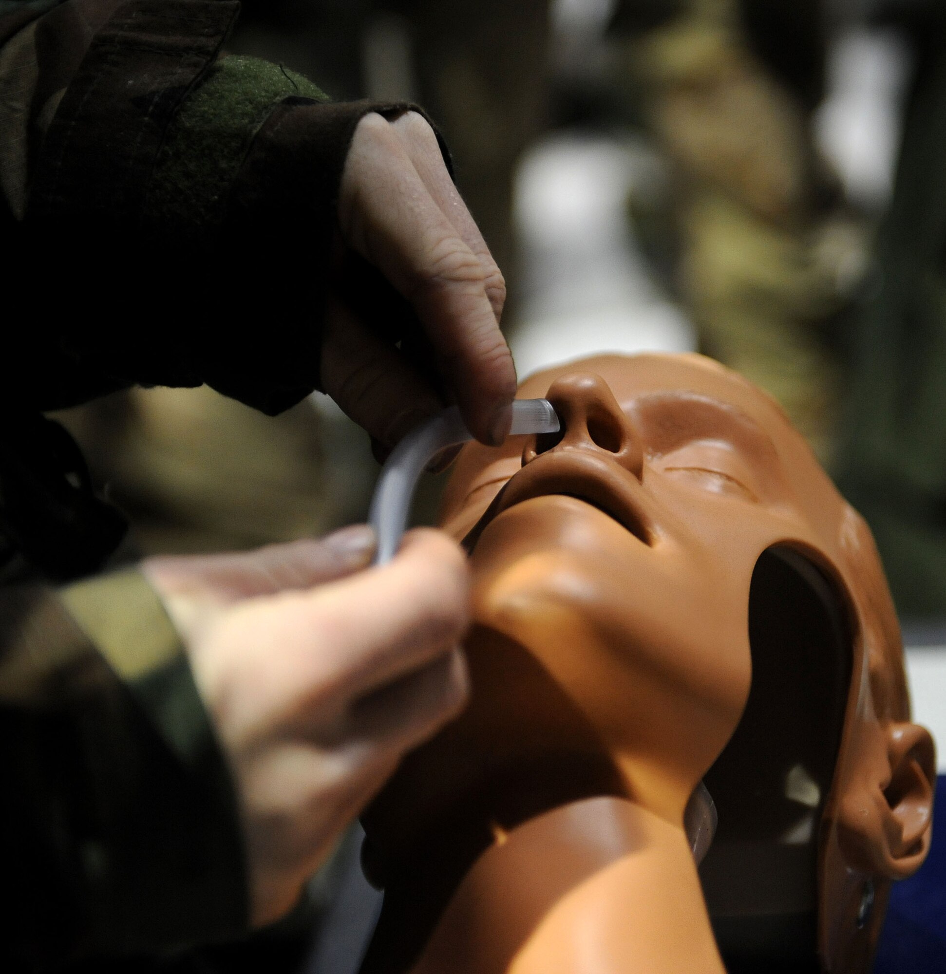 LANGLEY AIR FORCE BASE, Va. -- Senior Airman Jeffery Koeller, from the 1st Logistics Readiness Squadron, practices the "ABC's" - airway, breathing, and circulation- on a mannequin during self aid buddy care training as part of an Ability to Survive and Operate Rodeo here Feb. 4. The rodeo provided training to more than 700 Airmen to prepare them for deployment.   (U.S. Air Force photo/Airman Rebecca Montez)