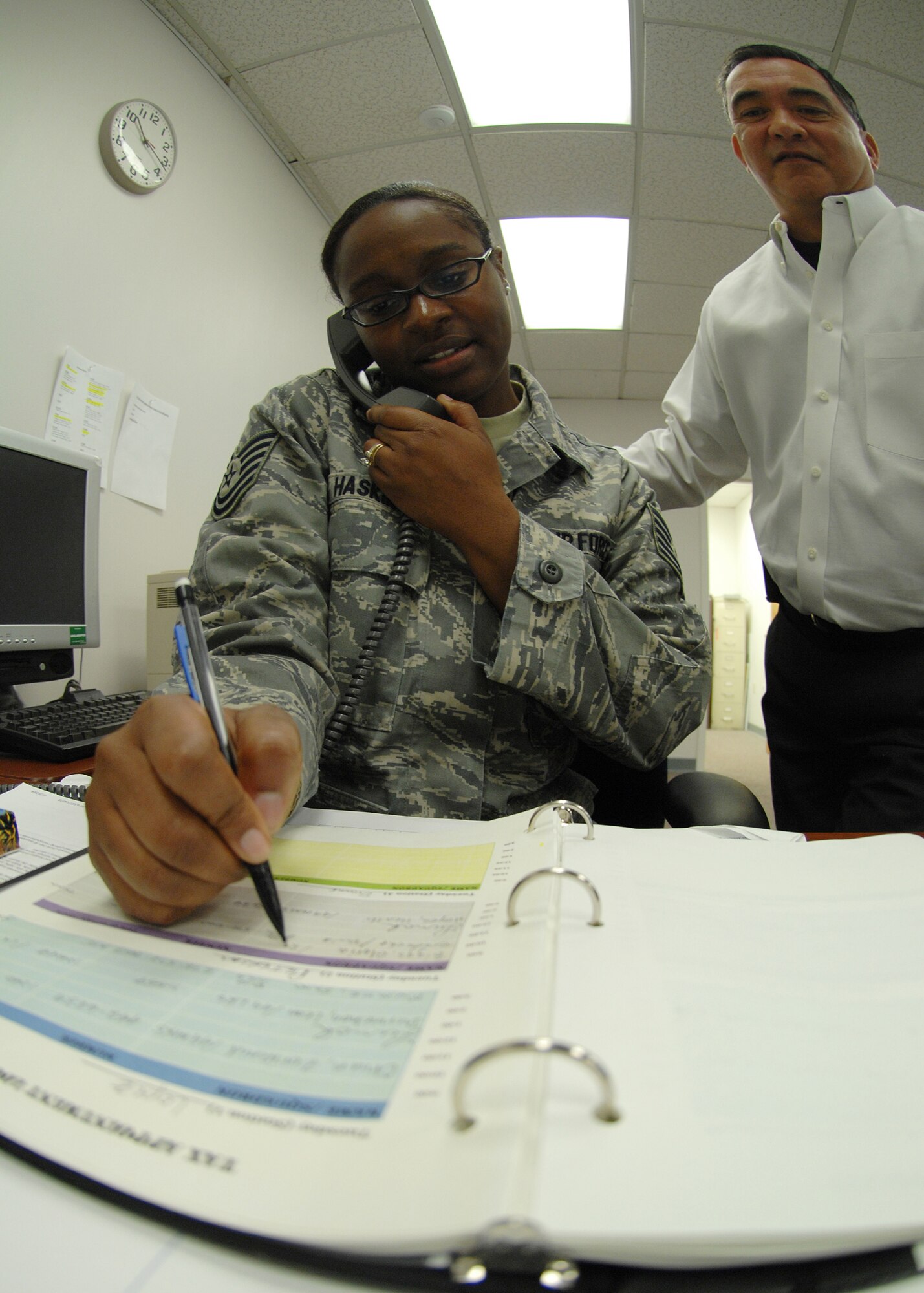 Tech. Sgt. Tynisa Haskins, 49th Fighter Wing Tax Center manager, takes an appointment over the telephone at the Tax Center located in building 29 at Holloman Air Force Base, N.M., Feb. 4. The Tax Center will be open until April 15, the last day income taxes can be regularly filed without penalty. (U.S. Air Force photo/Staff Sgt. Anthony Nelson Jr.)