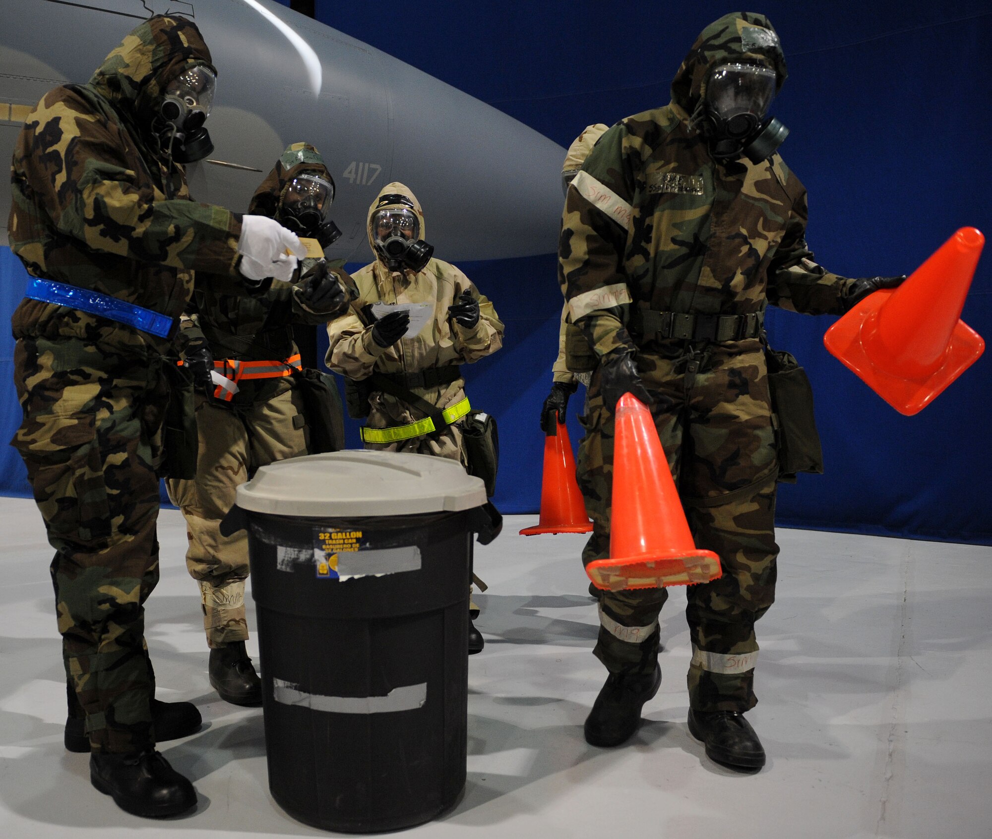 LANGLEY AIR FORCE BASE, Va. -- Airmen from the 1st Civil Engineer Squadron set up a cordon around a simulated contaminated item during an Ability to Survive and Operate Rodeo here Feb. 4. The rodeo provided training to more than 700 Airmen to prepare them for deployment.   (U.S. Air Force photo/Airman Rebecca Montez)