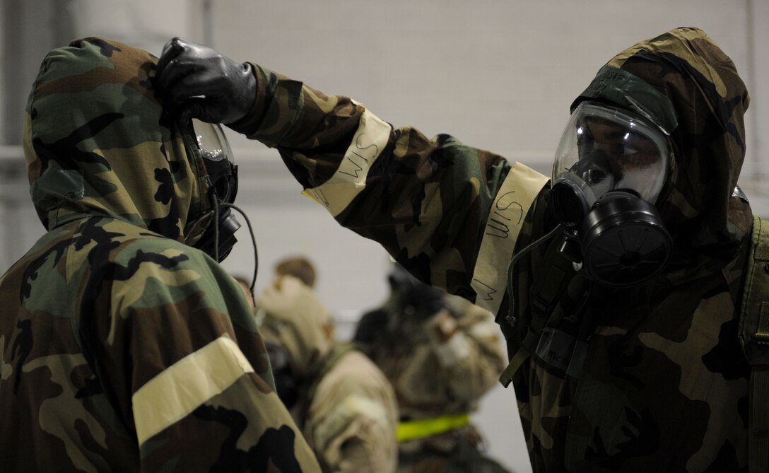 LANGLEY AIR FORCE BASE, Va. -- Airman Basic Eddy Jimenez, 1st Component Maintenance Squadron performs a "buddy check" on his wingman during an Ability to Survive and Operate Rodeo here Feb. 4. The rodeo provided training to more than 700 Airmen to prepare them for deployment.   (U.S. Air Force photo/Airman Rebecca Montez)