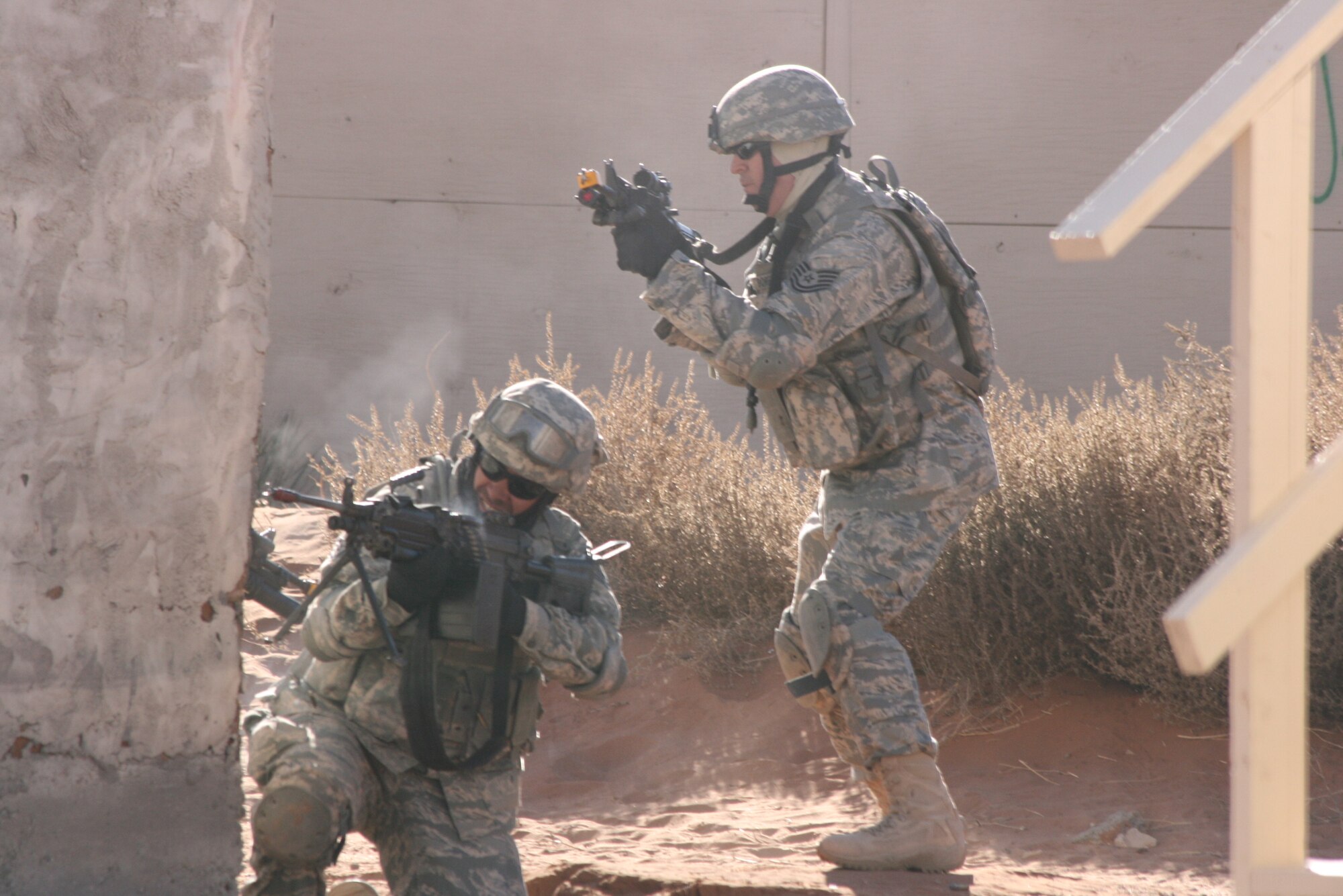 Airmen from the 376th Expeditionary Security Forces Squadron react to sniper fire during a countersniper training exercise at McGregor Range, N.M. Photo by Maj. Deanna Bague, Fort Bliss Public Affairs Office
