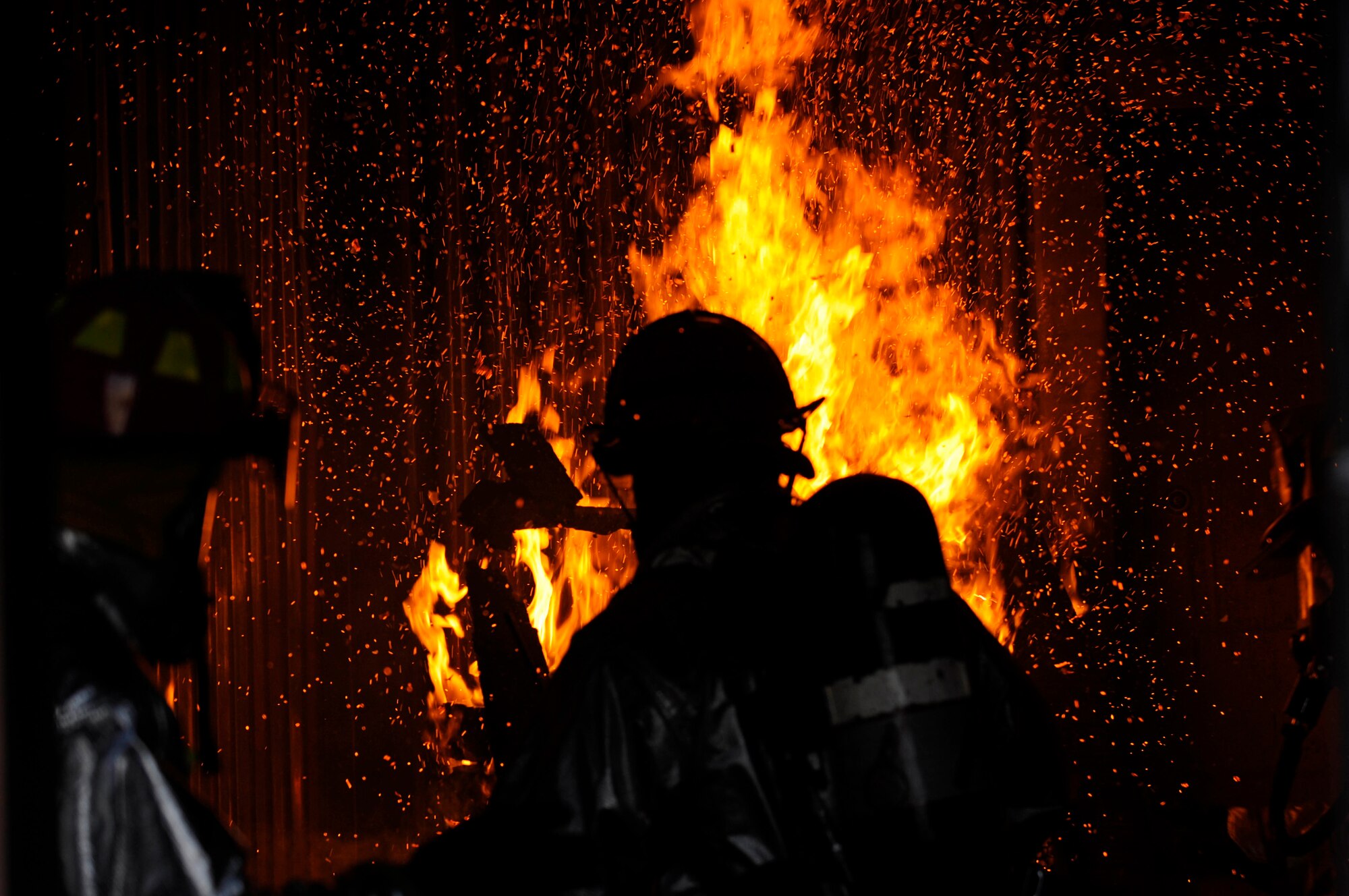 Firefighters from the 28th Civil Engineer Squadron fire department conduct a structural training fire here, Feb. 4. The simulated structural fires allow firefighters to safely practice extinguishing fires to maintain operational readiness. (US Air Force photo/Airman 1st Class Corey Hook)