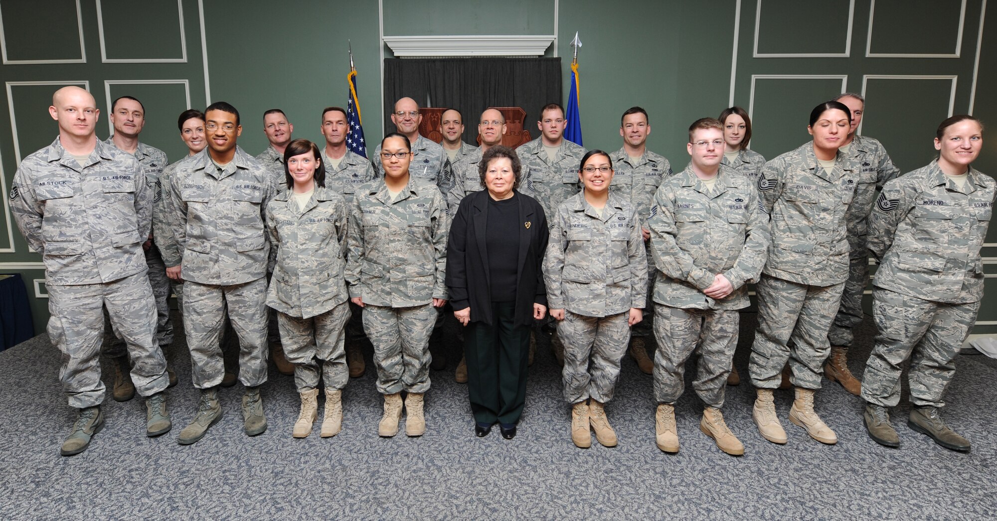 SHAW AIR FORCE BASE, S.C.-- Recipients of the JJ Pollack Sharp Troop Award stand with Mrs. Judy Pollock, wife of Chief Master Sergeant JJ Pollock, and team Shaw Chiefs, Feb. 5.  When Chief JJ Pollock was stationed at Shaw AFB in 1993, he established the Shaw Sharp Troop Award to recognize outstanding junior enlisted Airman.  After his death, one year later, the award was named in his honor.   (U.S. Air Force photo/Senior Airman William Coleman)