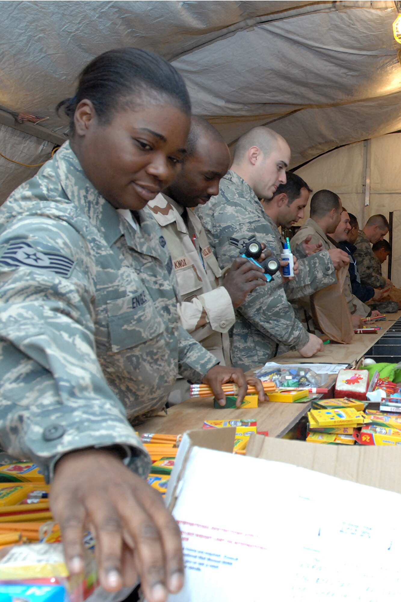 Tech. Sgt. Ingrid Engle of the 506th Expeditionary Logistics Readiness Squadron at Kirkuk Regional Air Base, Iraq, packs school supplies Jan. 29, 2009. The Loxahatchee, Fla., native was one of 30 Airmen to volunteer for the base chapel's Operation School Supply drive for Iraqi children. Sergeant Engle is an Air Force reservist from Homestead Air Reserve Base, Fla., where she works as an air transportation specialist in the 70th Aerial Port Squadron. (U.S. Air Force photo/Senior Airman Eunique Stevens)