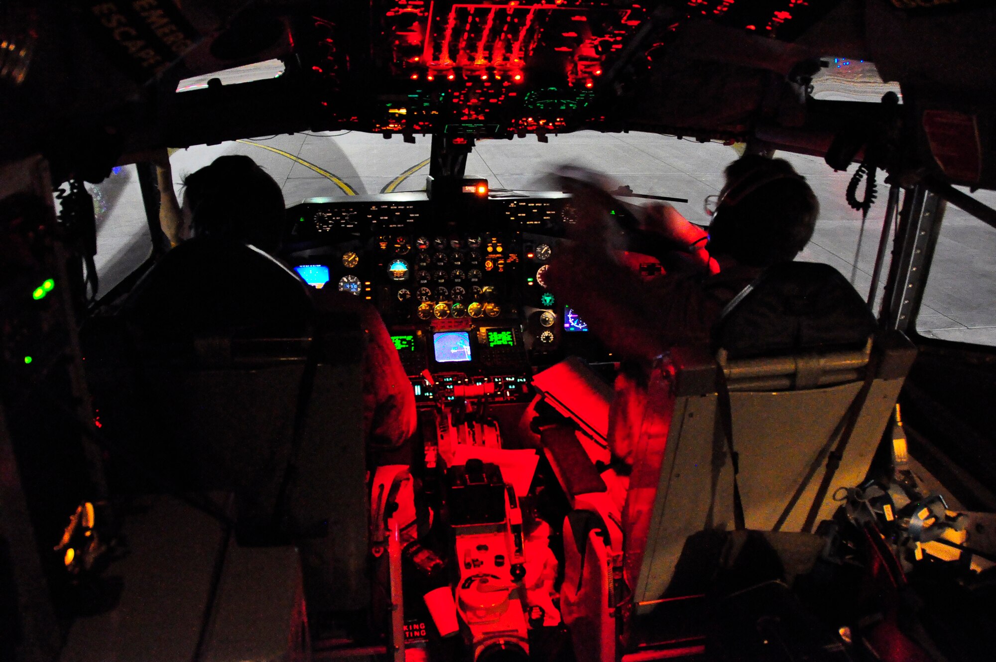 Pilots from the 18th Air Refueling Squadron go through preflight procedures inside the cockpit of a KC-135 Stratotanker used for an aeromedical evacuation out of Afghanistan. The 18th ARS is part of the 931st Air Refueling Group, an Air Force Reserve unit at McConnell Air Force Base, Kan. Eight Airmen from the 931st volunteered for the recent 12-day mission. (U.S. Air Force photo/Lt. Col. Tsuyoshi Tung)