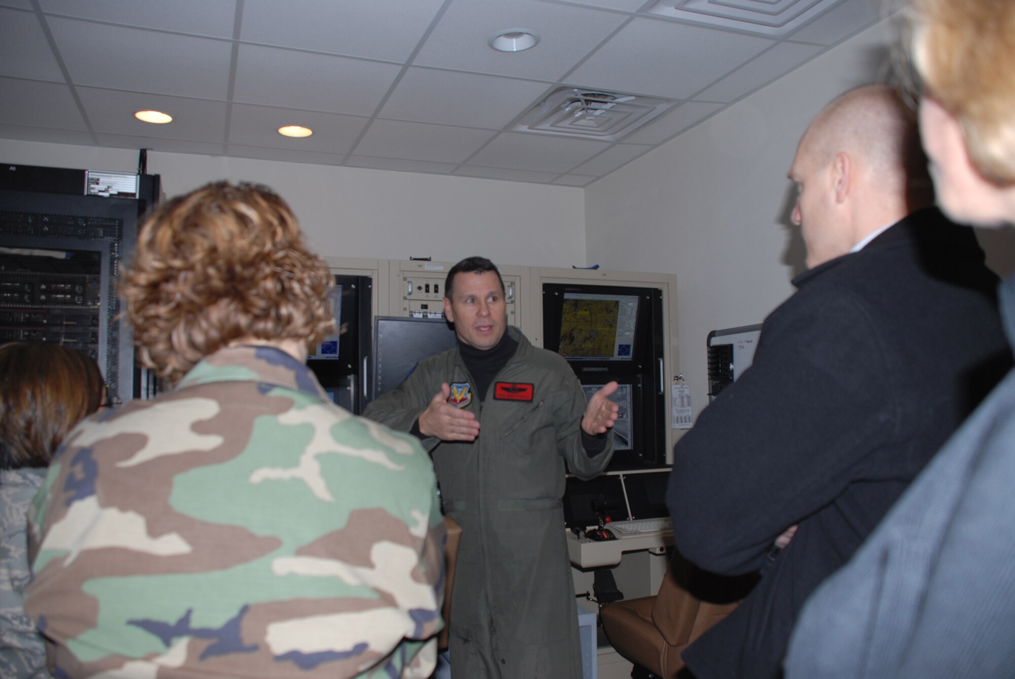 CREECH AFB, Nev. -- Colonel John Montgomery, 432d Wing and 432d Air Expeditionary Wing vice commander, briefs participants of the UAS Aeromedical Summit on the MQ-1B Predator simulator training Jan. 28. (U.S. Air Force photo/Staff Sgt. Alice Moore)