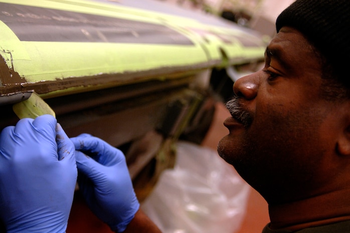 James Singletary replaces rub strips on an aileron from a C-17 wing at the 437th Maintenance Squadron Aircraft Structural Maintenance Shop Feb. 4. Ailerons are used to steer an aircraft once it's in the air. The 437 MXS Aircraft Structural Maintenance Shop performs all structural maintenance and corrosion control for all C-17s assigned to the base. Mr. Singletary is an aircraft structural journeyman with the 437 MXS. (U.S. Air Force photo/Senior Airman Timothy Taylor) 