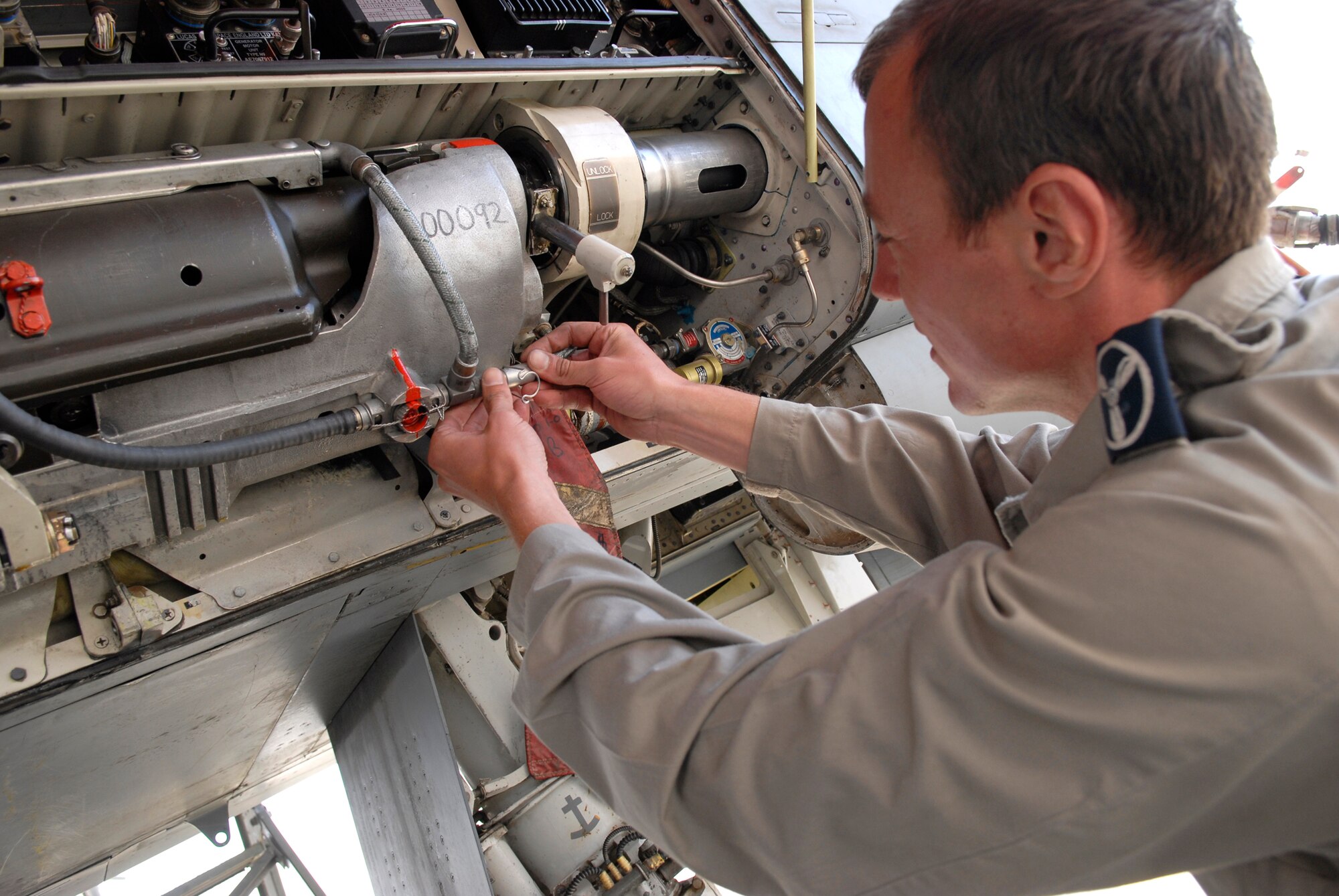 Senior Aircraftsman Paul Myhill, 9th Bomber Squadron detachment, inspects the electrical system for the gun turret on a Tornado GR4 aircraft Feb. 4, 2009, at an undisclosed location in Southwest Asia.  SAC Myhill hails from Norwich, England and is deployed from Royal Air Force Marham near Norfolk, England in support of Operation Iraqi Freedom. (U.S. Air Force photo by Airman 1st Class Andrew Satran/released)