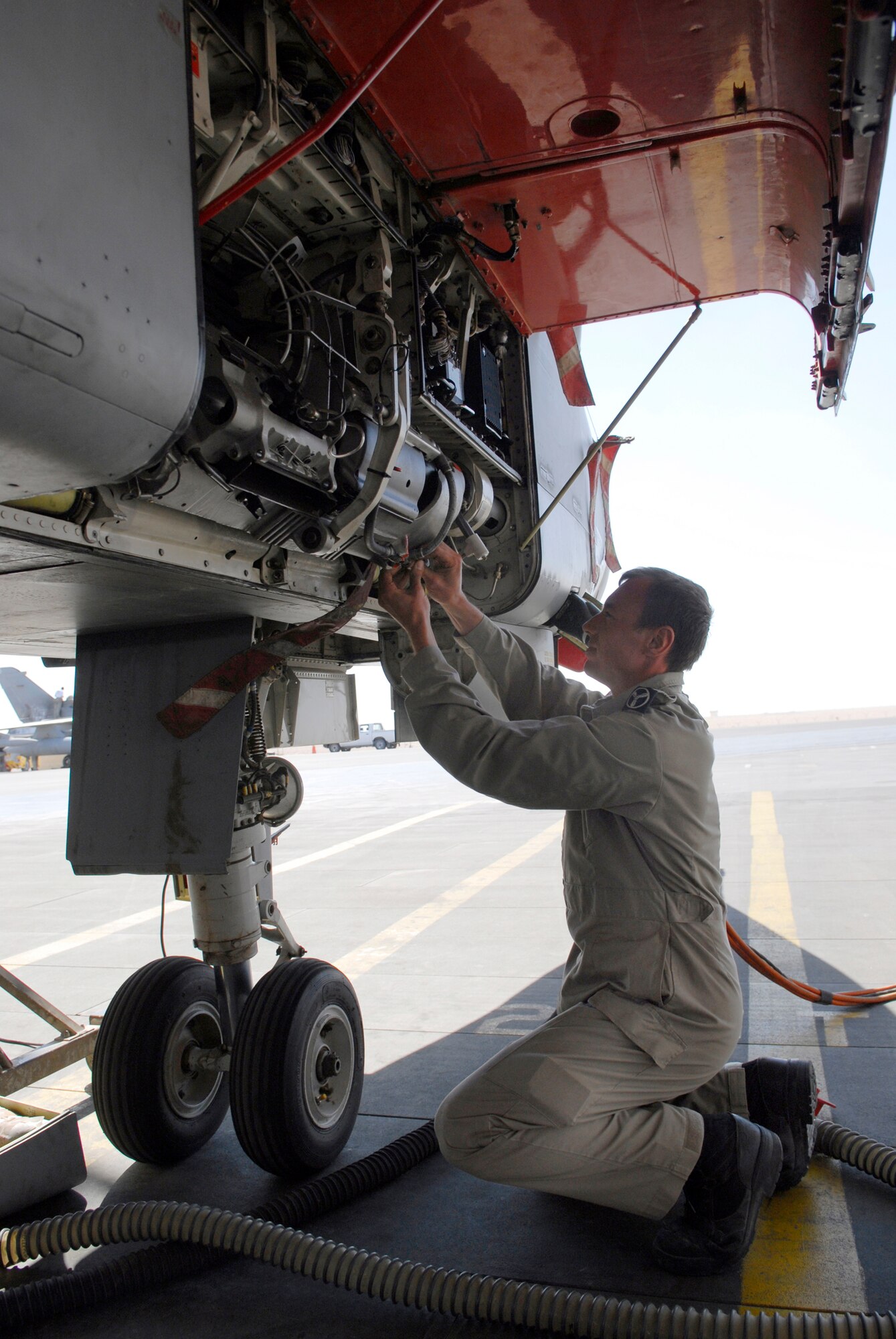 Senior Aircraftsman Paul Myhill, 9th Bomber Squadron detachment, inspects the electrical system for the gun turret on a Tornado GR4 aircraft Feb. 4, 2009, at an undisclosed location in Southwest Asia.  SAC Myhill hails from Norwich, England and is deployed from Royal Air Force Marham near Norfolk, England in support of Operation Iraqi Freedom. (U.S. Air Force photo by Airman 1st Class Andrew Satran/released)