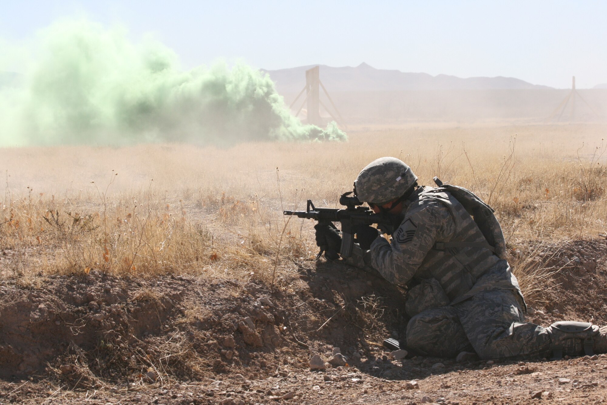 Air Force Master Sgt. Mike LaPlaca from the 144th Fighter Wing, California Air National Guard, fires at targets during a convoy live fire exercise at McGregor Range, N.M.  Photo by Maj. Deanna Bague, Fort Bliss Public Affairs Office