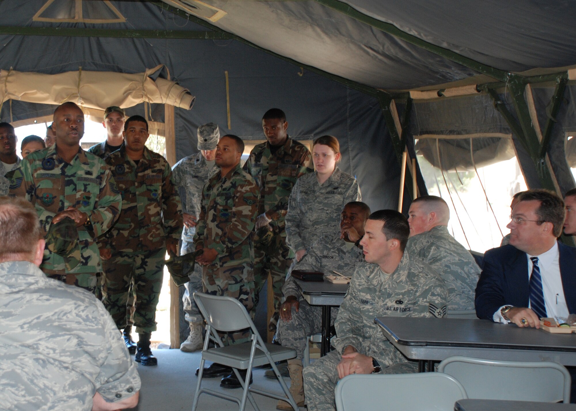 MSgt. Cleon Peoples, Food Operations Superintendant briefs the Hennessy Evaluation Team, along with the Chiefs Group and FTAC during a food service exercise Tuesday.  They made meals for the group that was here to evaluate the 325th Force Support Squadron Food Service Section.  Tyndall won the award last year.  (U.S. Air Force photo by Sarah English)