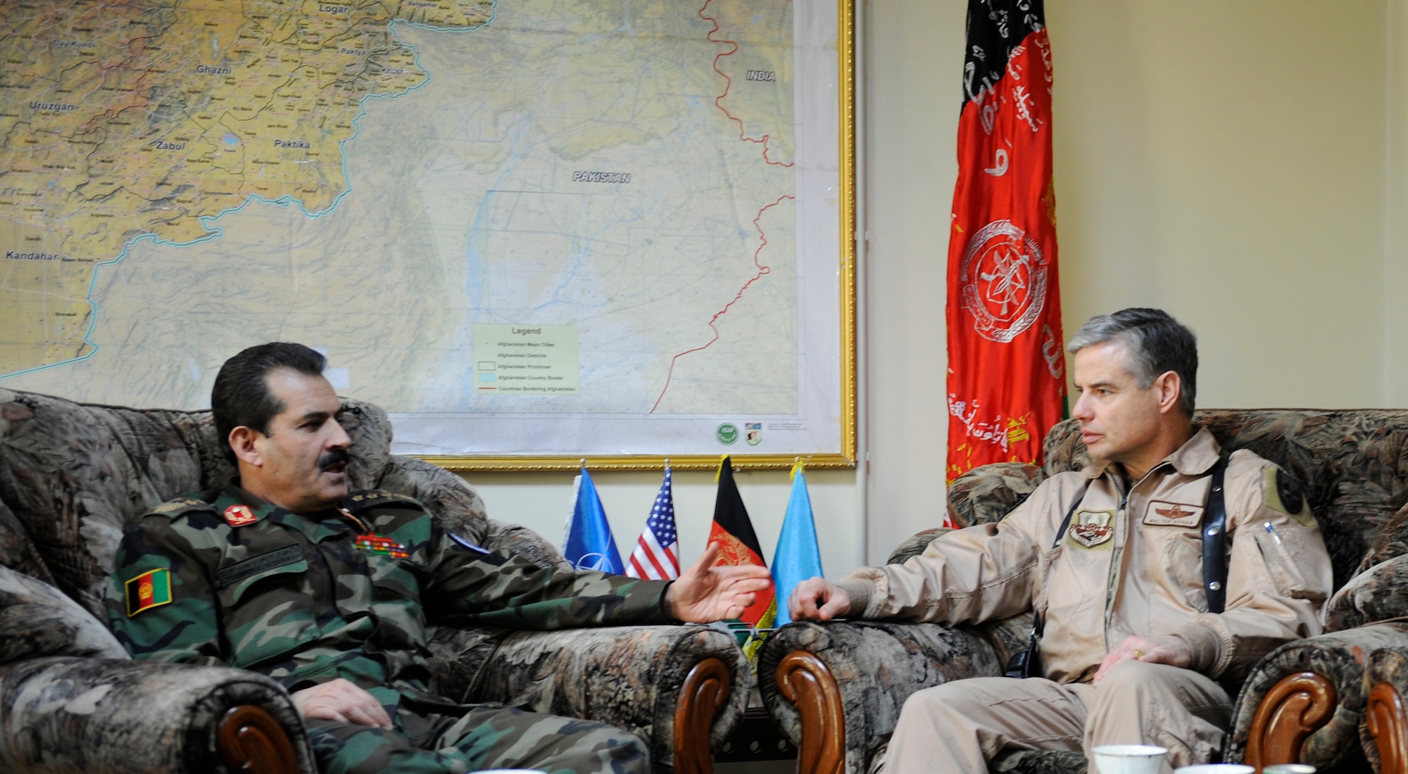 U.S. Air Force Brig. Gen. Walter Givhan, 438th Air Expeditionary Wing and CAPTF commander, and  Maj. Gen. Mohammed Darwan, Afghan National Army Air Corps commander, discuss airpower issues in Kabul Afghanistan on Jan. 24, 2009.(U.S. Air Force photo by Staff Sgt. James L. Harper Jr.)Released