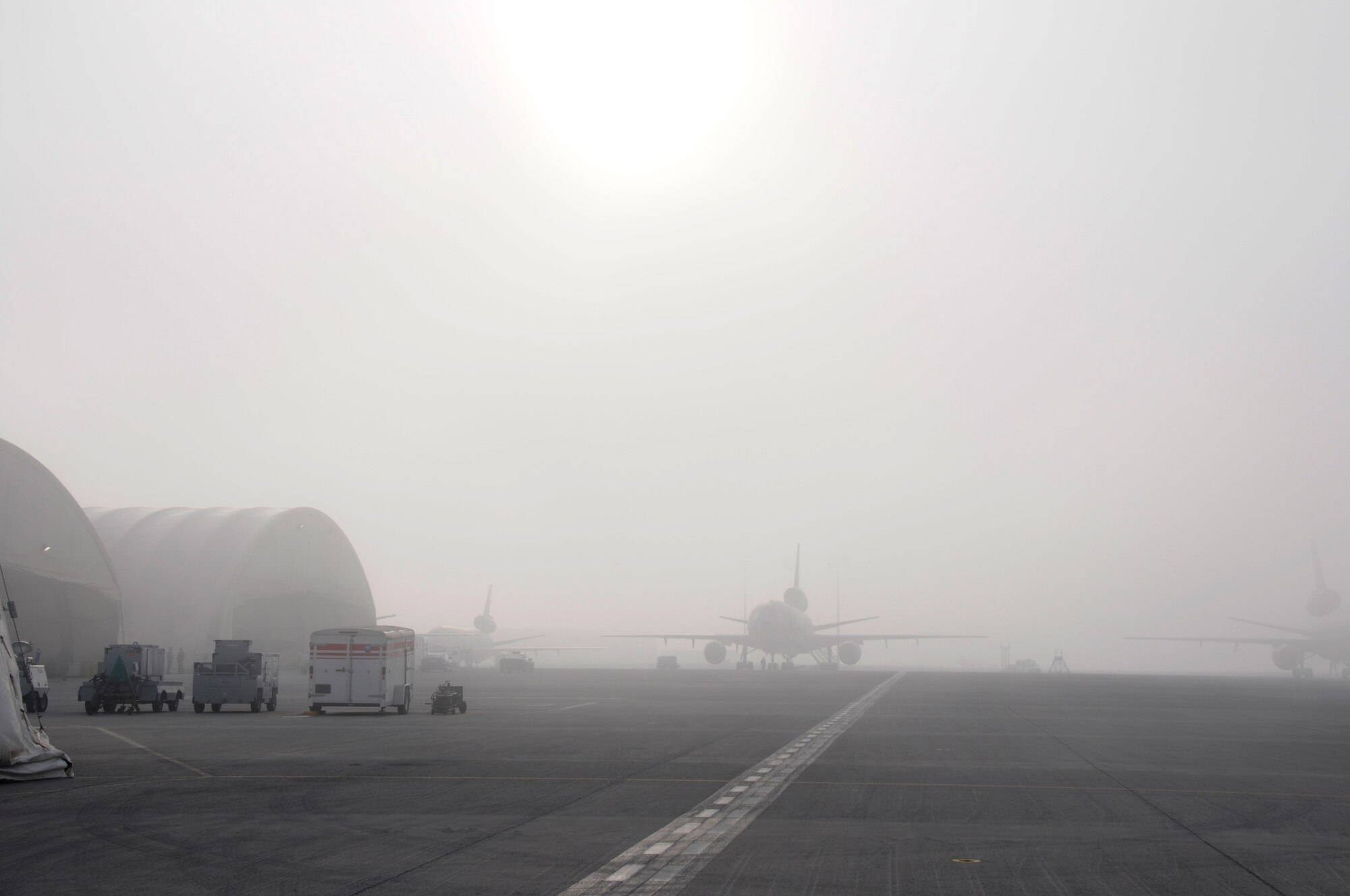 SOUTHWEST ASIA - A KC-10 Extender sits on the flightline at the 380th Air Expeditionary Wing as the sun breaks through on a foggy morning, Jan 28. The 380th AEW stands mission ready no matter the weather conditions. (U.S. Air Force photo by Senior Airman Brian J. Ellis) (Released)