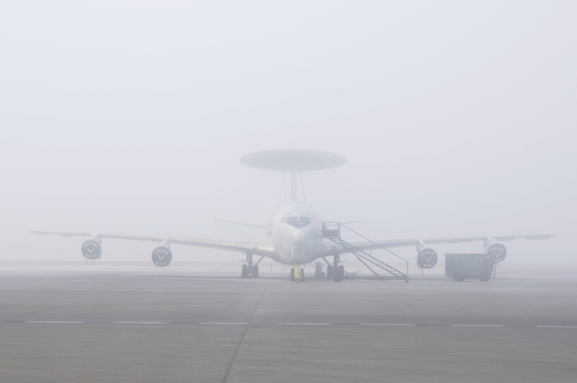 SOUTHWEST ASIA - An E-3 Sentry sits on the flightline at the 380th Air Expeditionary Wing as the sun breaks through on a foggy morning, Jan 28. The 380th AEW keeps all aircraft ready to fly in any weather condition. The E-3 Sentry is at the 380th from Tinker AFB, Okla.  (U.S. Air Force photo by Senior Airman Brian J. Ellis) (Released)