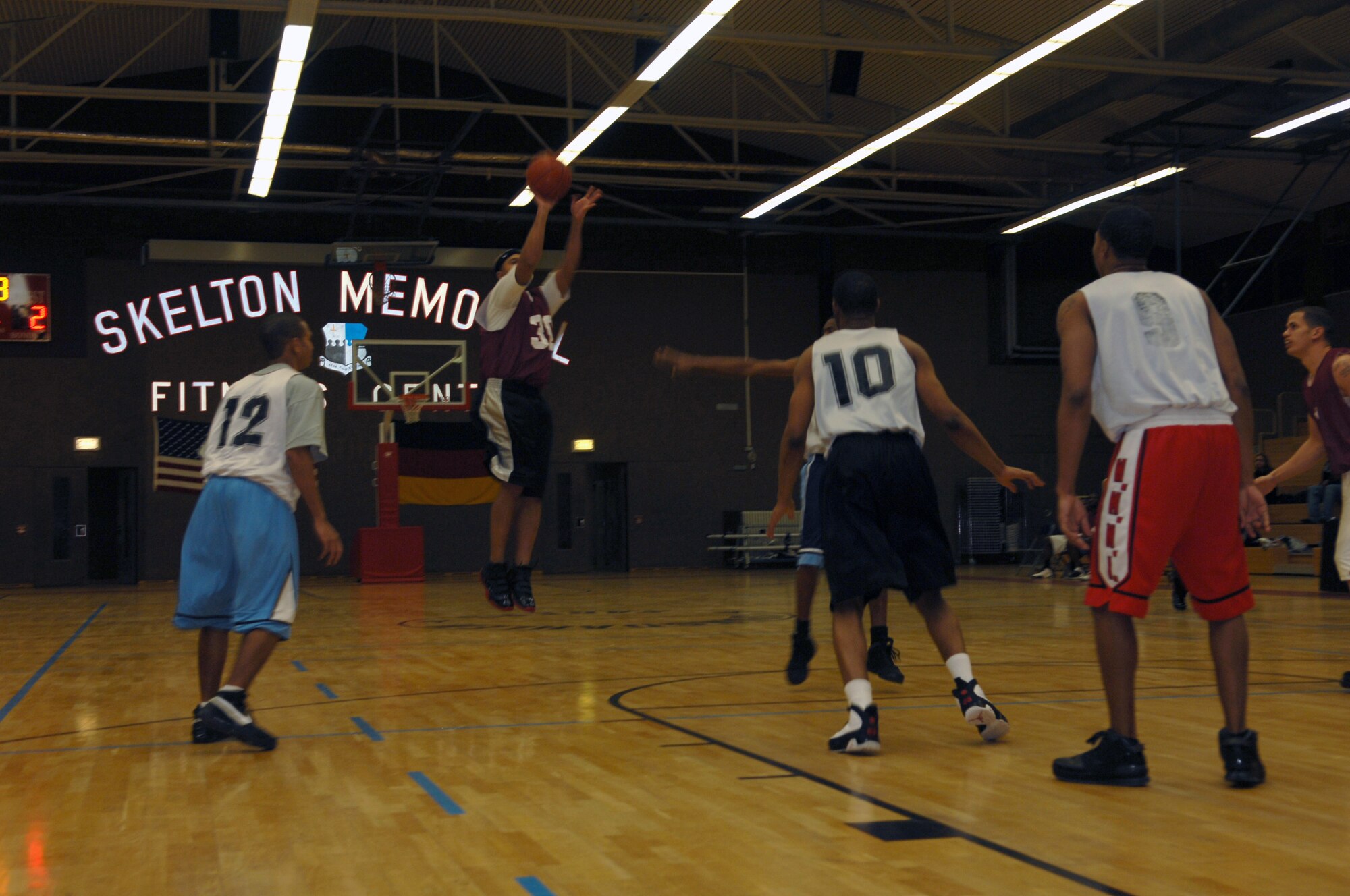 SPANGDAHLEM AIR BASE, Germany -- Senior Airman Julian Hodge, 52nd Civil Engineer Squadron, makes a shot at the beginning of an intramural basketball playoff game against the 52nd Security Forces Squadron Jan. 27, 2009.  The 52nd SFS defeated the 52nd CES with a score of 55-42 to advance in the tournament. (U.S. Air Force photo by Senior Airman Allen Pollard)