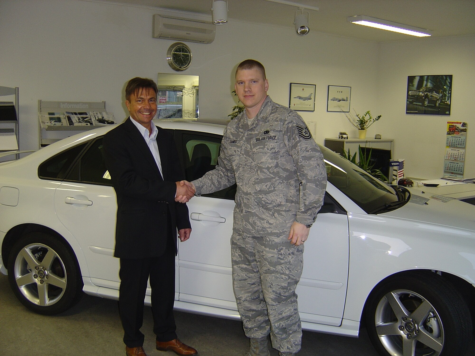 SPANGDAHLEM AIR BASE, Germany -- Tech. Sgt. Ma rc James, 52nd Communicat ions Squadron, receives the keys to his new Volvo S-40 from Mitch Penross, Capitol Motors sales consultant, Jan. 28, at Capitol Motors. Sergeant James was the winner out of more than 18,000 worldwide participants who entered the contest. The giveaway was a promotion for Volvo’s support for military members. (Courtesy photo)