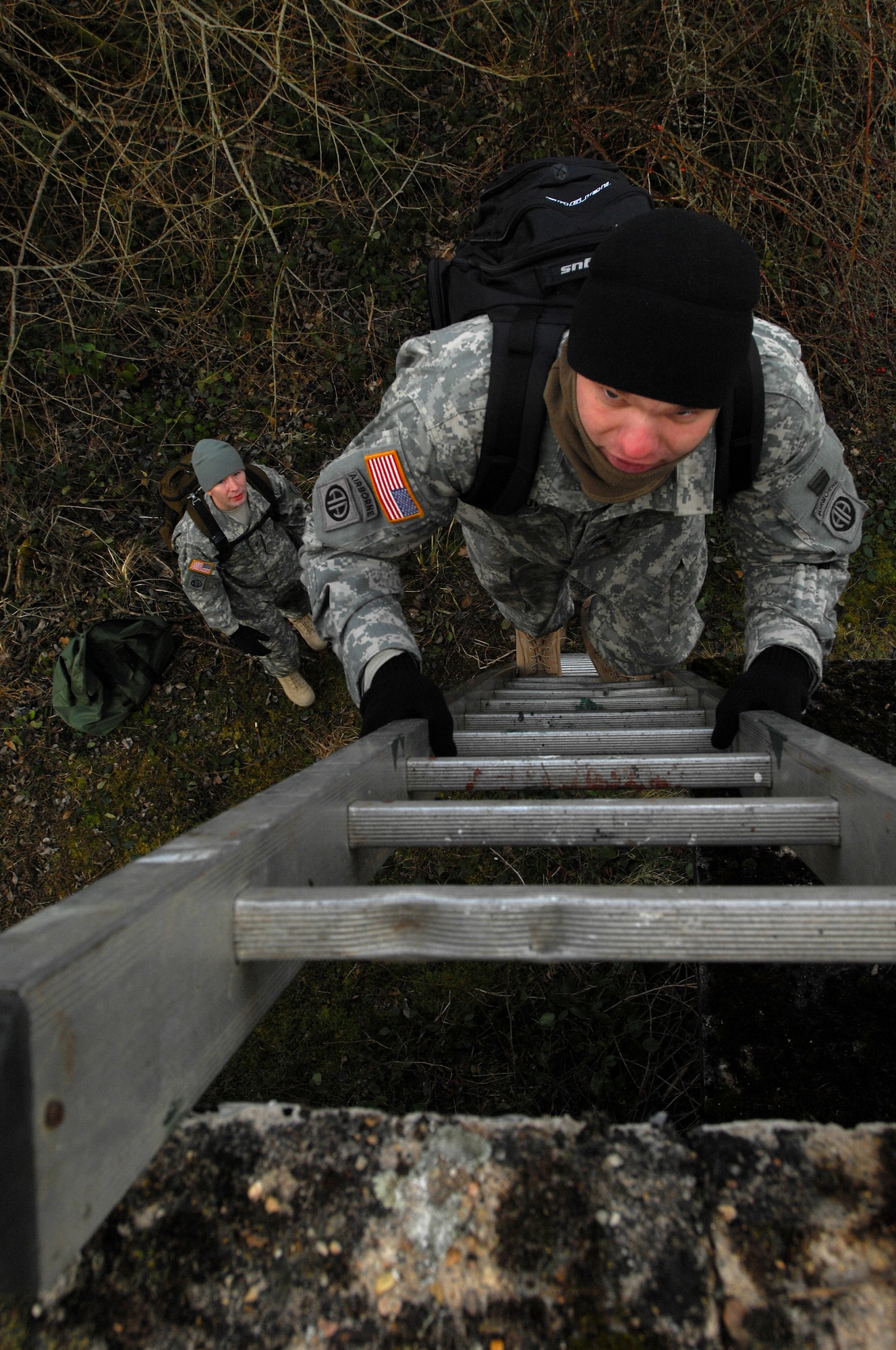 Army Sgt. Andrew Goudy, Joint Fire Observer, climbs a ladder to the roof of an abandoned building to get in a good position to plot coordinates of enemy targets during a Joint Fire observers and Joint Terminal Air Controllers exercise, Jan. 29, 2009, in Southern France. Army JFOs and Air Force JTAC students worked together during the exercise to reach mission success.  (U.S. Air Force photo by Airman 1st Class Kenny Holston) 