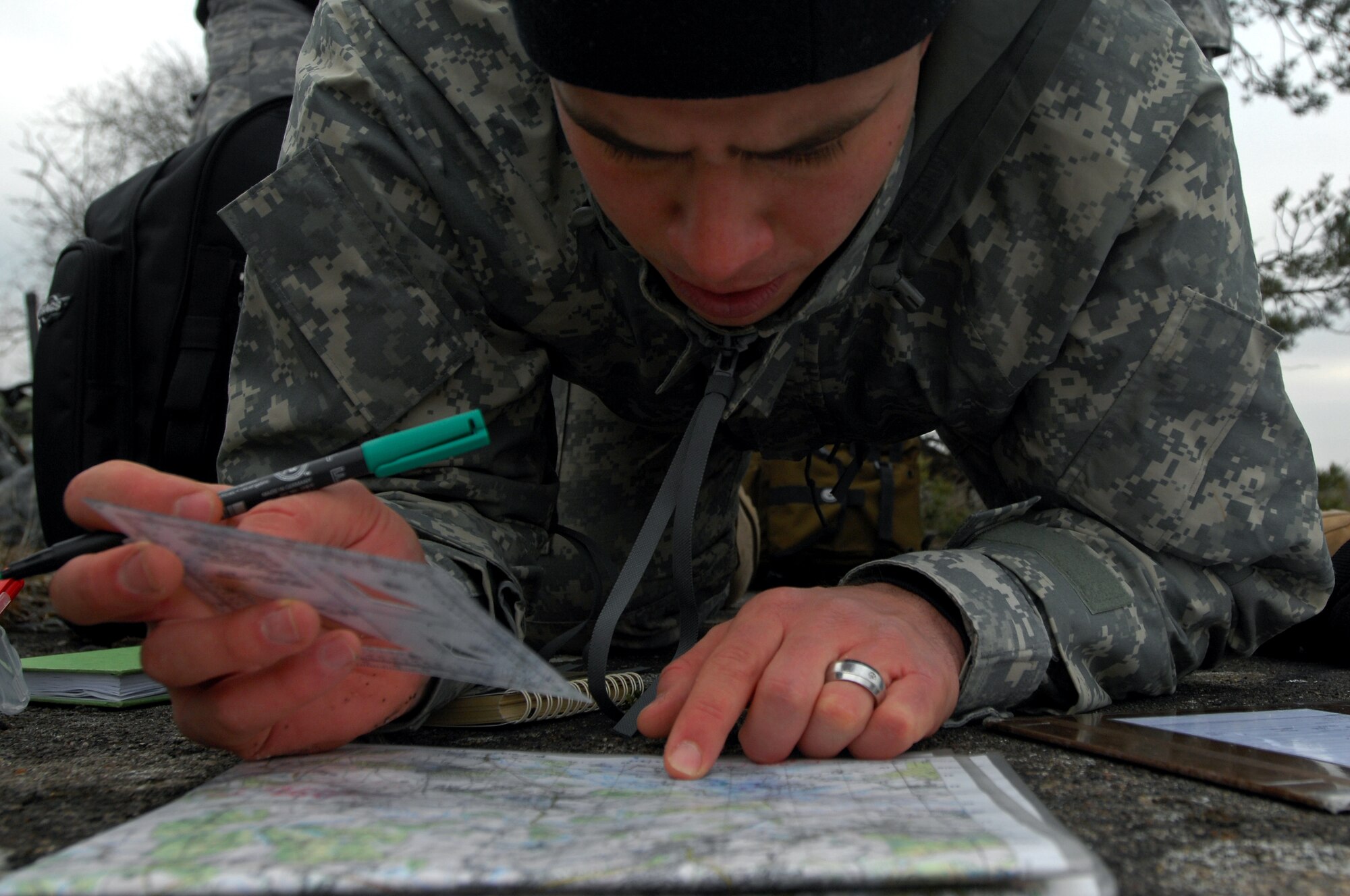 Army Sgt. Albert Dyk, Joint Fire observer, plots coordinates to call in an air strike while under pressure from his cadre instructor during a Joint Fire Observers and Joint Terminal Air Controllers exercise, Jan. 29, 2009, in Southern France. Army JFOs and Air Force JTAC students worked together during the exercise to reach mission success. (U.S. Air Force photo by Airman 1st Class Kenny Holston)  