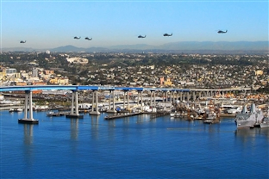 U.S. Navy SH-60 Seahawk helicopters fly over the San Diego-Coronado Bay Bridge, Calif., Feb. 3, 2009, to prepare for an exercise.