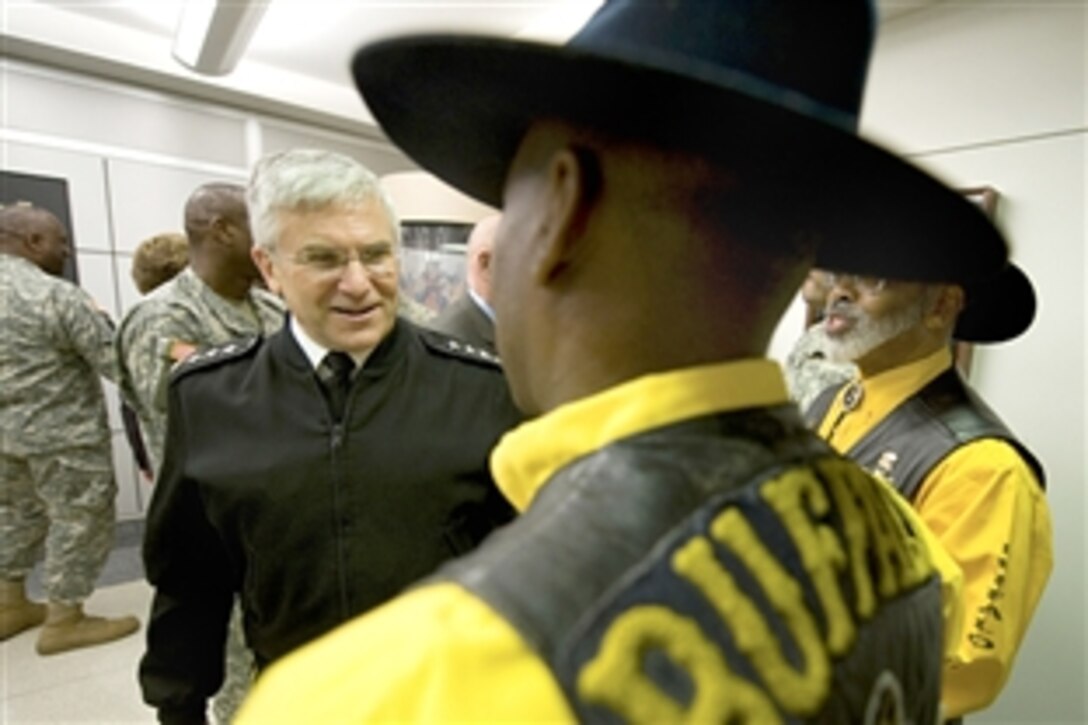 U.S. Army Gen. George W. Casey Jr., the Army's chief of staff, talks with members of a Buffalo Soldier chapter after a ceremony at the Pentagon, Feb. 5, 2009. During February, the Army celebrates and pays tribute to African-American soldiers and recognizes their contributions in past and current wars.  
