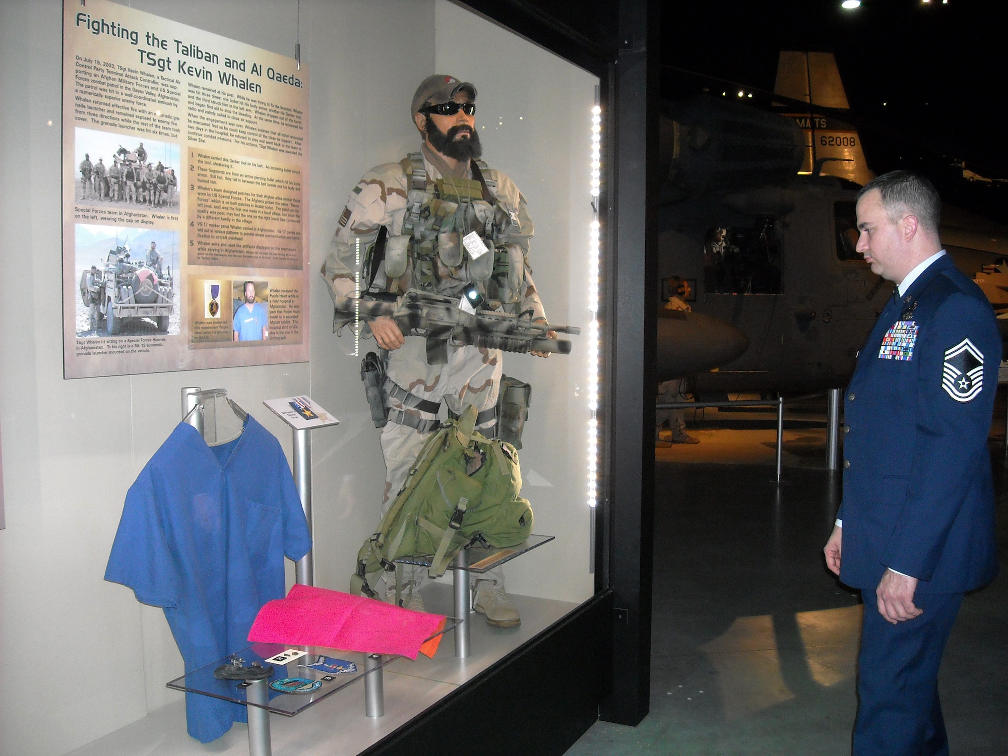 Senior Master Sergeant (SMSgt) Kevin Whalen views a display featuring a younger, bearded version of himself at the National Museum of the United States Air Force, Wright-Patterson AFB, Ohio on the opening night of the new "Warrior Airmen" exhibit there on January 12, 2009. The SMSgt Whalen display recalls his actions during an ambush in Afghanistan on July 19, 2003 in which he won a Purple Heart and Silver Star. (U.S. Air Force photo by Captain Lisa Dowling)