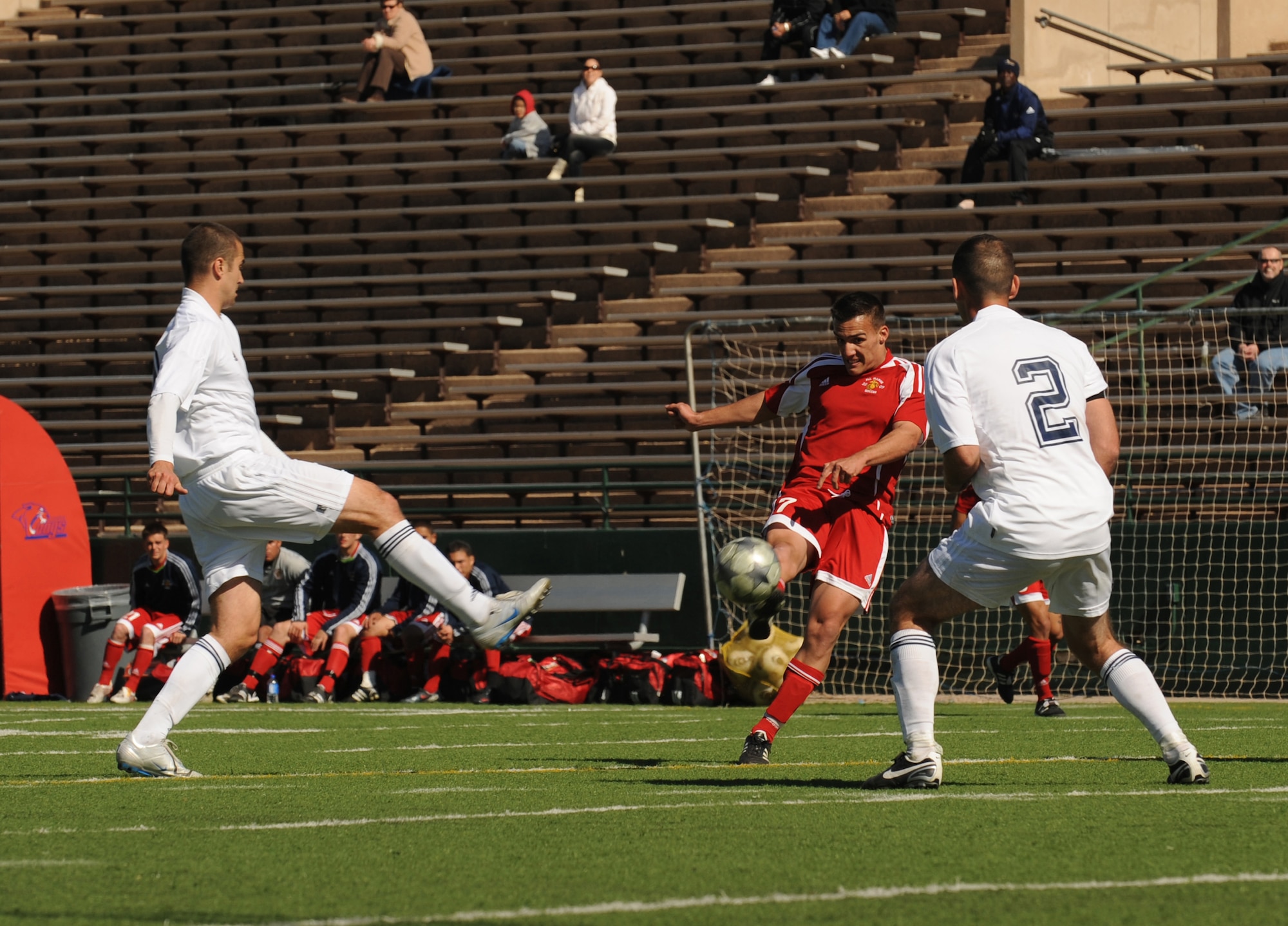 ABILENE, Texas -- Marine Corporal Yoan Alonso attempts a shot on goal during the All Marine Soccer Team's match against the All Navy Team here, Feb. 5.  The All Navy Team won the match, improving their record to two wins, one loss, and one tie in the U.S. Armed Forces Soccer Championship.  (U.S. Air Force photo by Staff Sgt. Alan Garrison) 
