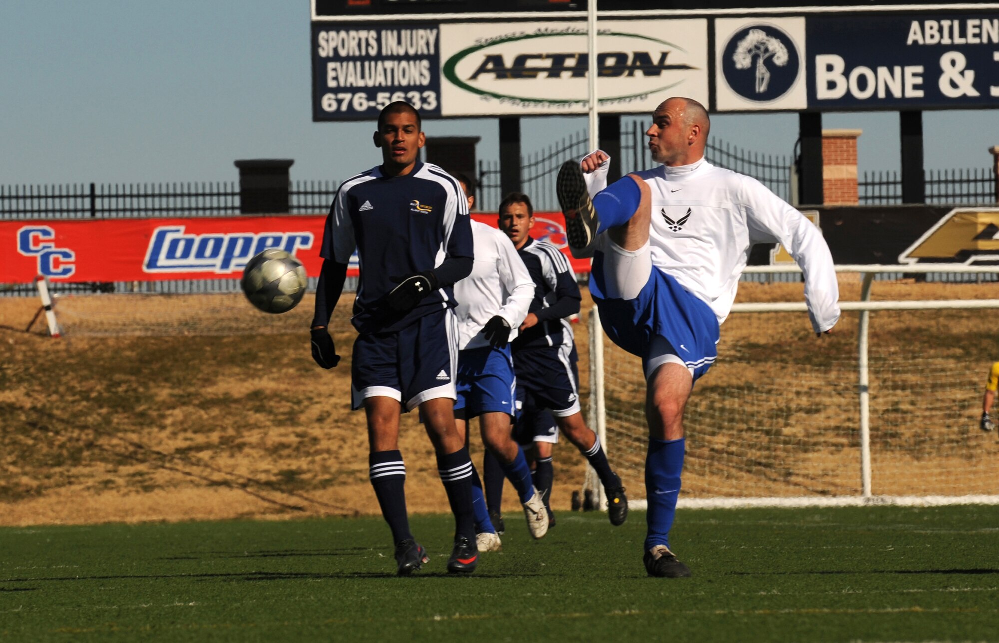 ABILENE, Texas -- Staff Sgt. Janusz Jaworek attempts to reverse the ball during a match between the All Air Force and All Navy Teams here, Feb. 4.  The All Air Force Team won the match with a score of 4-0, improving their record to one win and one loss in the U.S. Armed Forces Soccer Championship.  (U.S. Air Force photo by Staff Sgt. Alan Garrison)