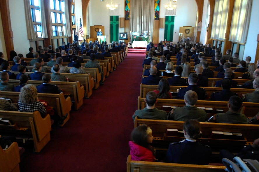 MINOT AIR FORCE BASE, N.D. --  Squadron members, friends, and family from here mourn the loss of Capt. Jonathan Bayless during a funeral service held here Feb. 4. Captain Bayless was a missileer and chief of training scenarios for the 91st Operations Support Squadron here. (U.S. Air Force photo by Senior Airman Joe Rivera)