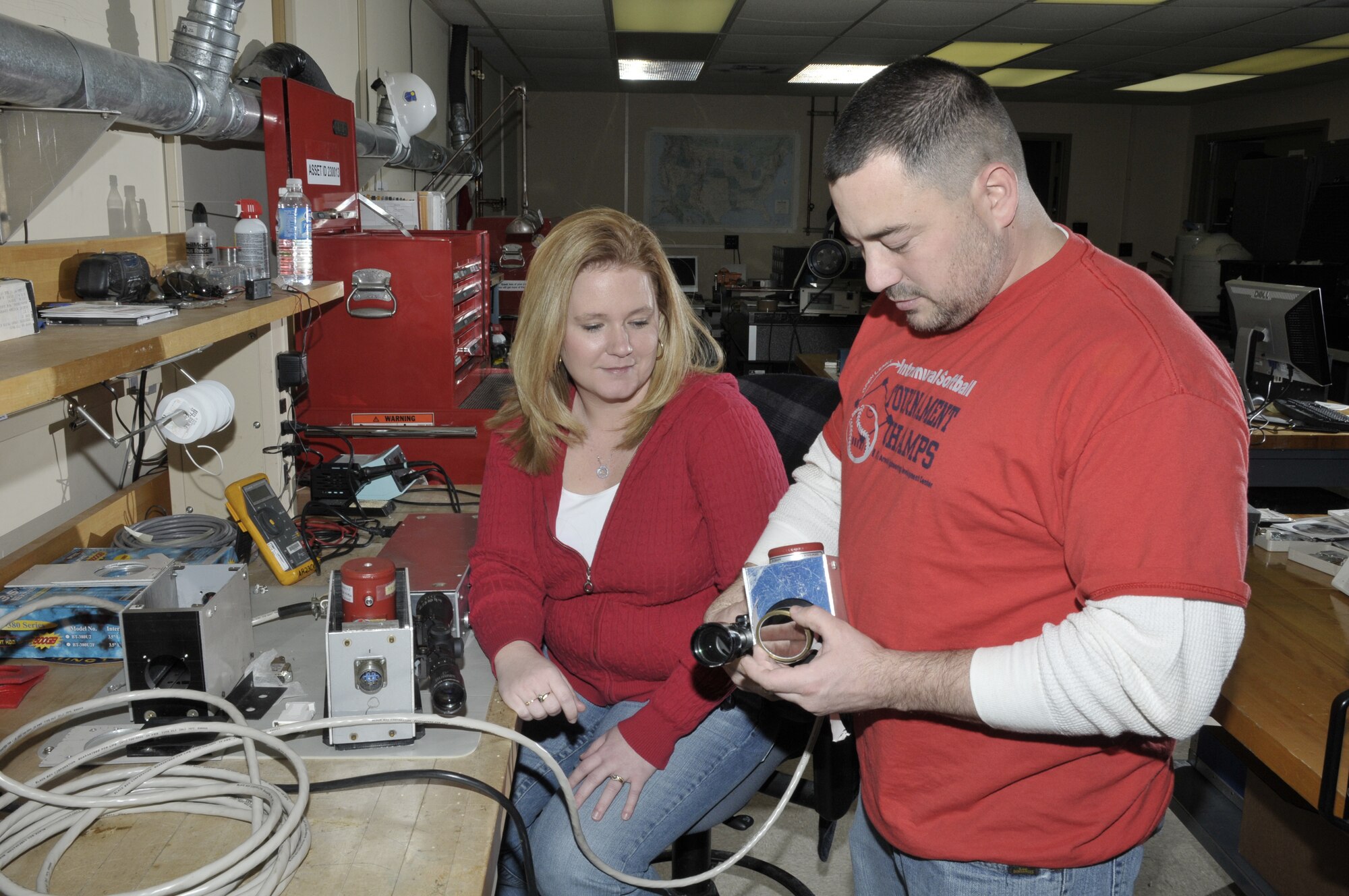 DeeDee Dockrey, an Aerospace Testing Alliance (ATA) signature measurement team engineer, and ATA Instrument Technician Matt Reel at the U.S. Air Force's Arnold Engineering Development Center, calibrate and prepare an infrared radiometer for a test. An infrared radiometer is an instrument that measures the intensity of infrared energy coming from a source, such as a missile plume from a shoulder launched missile. ATA is the support contractor for AEDC. (Photo by Rick Goodfriend)