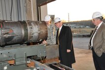 From left, Arnold Engineering Development Center's Capt. Chuck McNiel, an aeropropulsion test technology lead, explains to Air Force Chief Scientist Dr. Werner Dahm how this traversing system works for AEDC’s emissions rakes. The traversing system allows the rakes to be moved in and out of the J85 engine exhaust stream at UTSI’s Propulsion Research Facility. (Photos by David Housch)