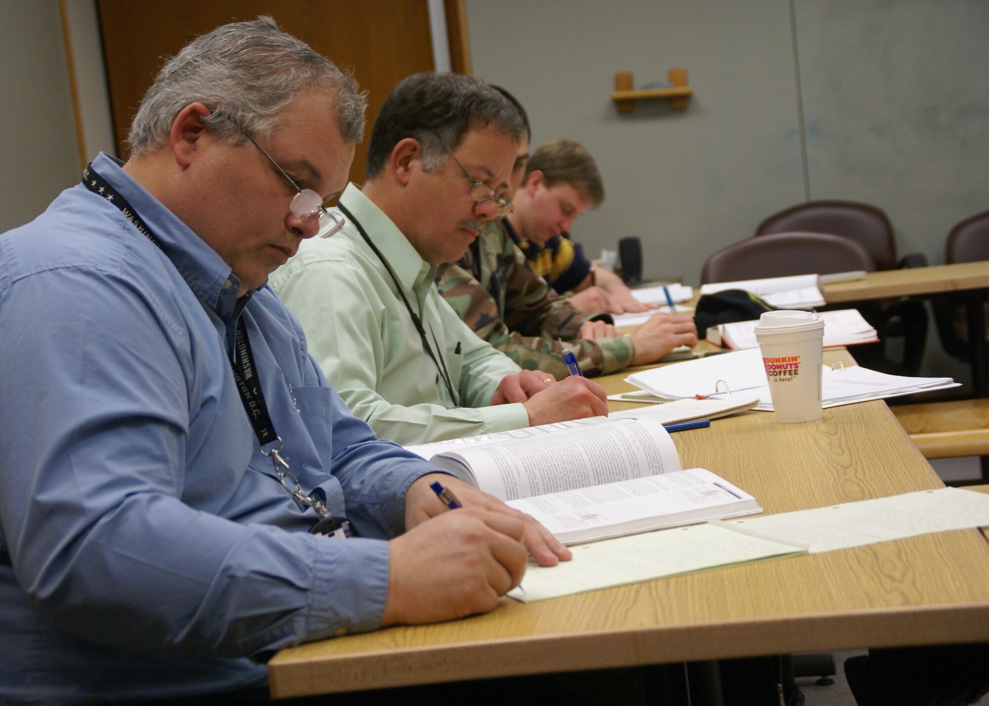 From left, Arnold Engineering Development Center engineers Ben Mills, Tony Harrison, 1st Lt. Bradley King and Nick Fredrick attend an on-base graduate studies class on thermodynamics offered by UTSI. (Photo by Philip Lorenz IIII)