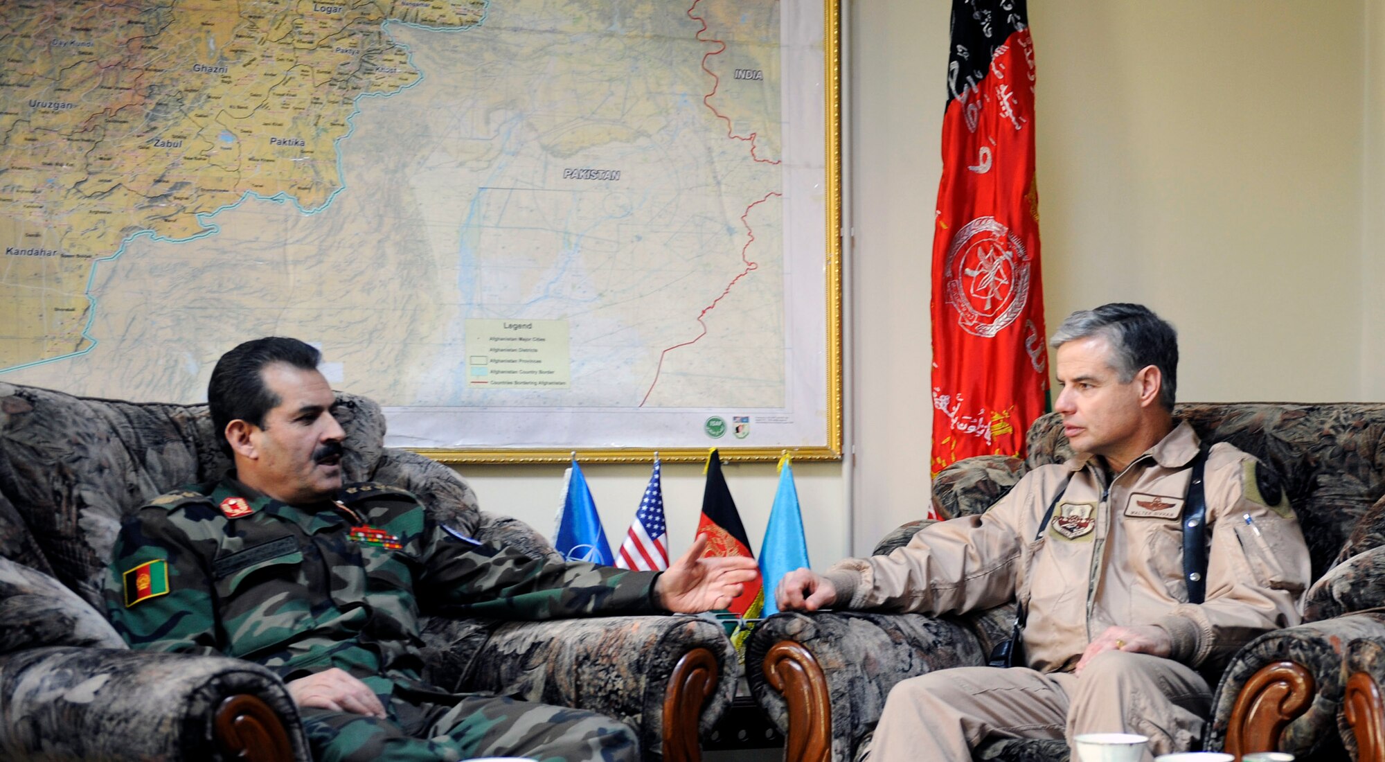 Brig. Gen. Walter Givhan and  Maj. Gen. Mohammed Darwan, Afghan National Army Air Corps commander, discuss airpower issues in Kabul, Afghanistan, Jan. 24. Airmen from the U.S. Air Force and the Afghan National Army Air Corps are working side-by-side to provide an airpower capability to the nation of Afghanistan. General Givhan is the 438th Air Expeditionary Wing and Combined Air Power Transition Force commander. (U.S. Air Force photo/Staff Sgt. James L. Harper Jr.)