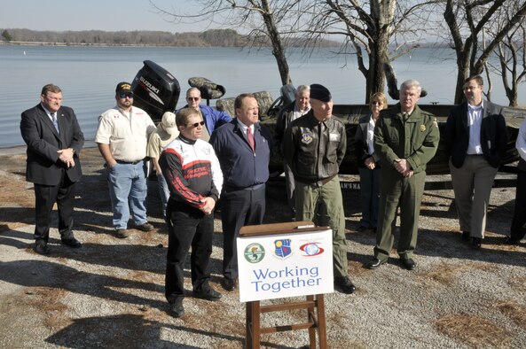 All Pro Rods National Sales Director Jake Davis, Franklin County Mayor Richard Stewart, AEDC Commander Col. Art Huber and TWRA Regional Manager Steve Patrick take questions during a ceremony today commemorating the re-opening of the Morris Ferry Dock boat ramp to the public. Also pictured, from left to right, are Franklin County Sheriff Tim Fuller, fishermen David, Hank and Jim Lowrie, Franklin County Road Commissioner Clyde Hill, County Commissioner Barbara Finney and State Senator Eric Stewart.  (Photo by Rick Goodfriend)