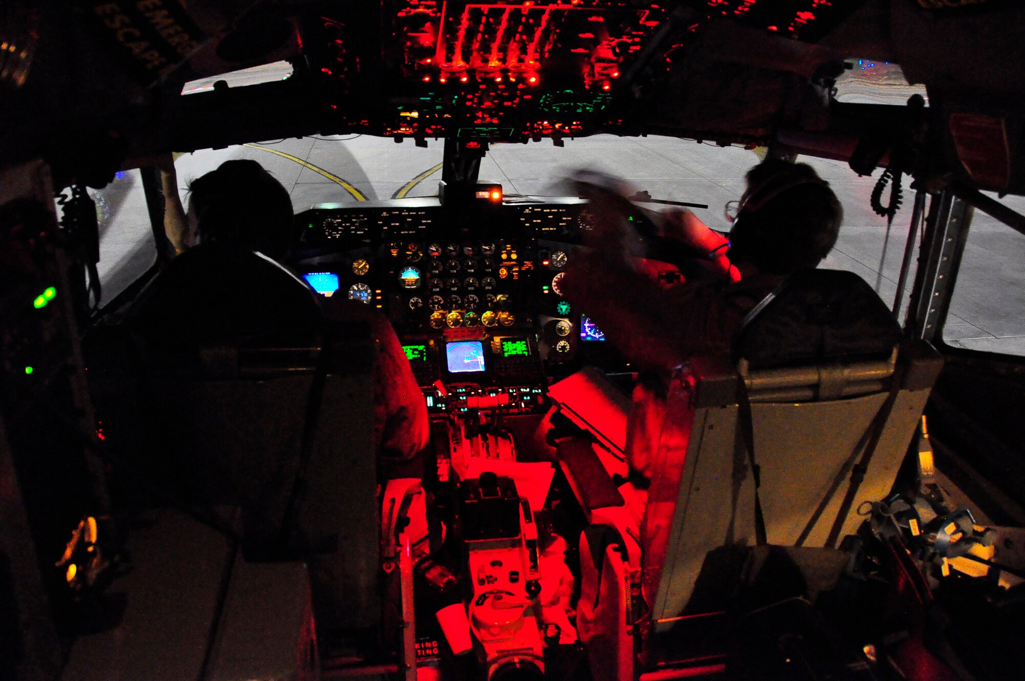 Pilots from the 18th Air Refueling Squadron go through preflight procedures inside the cockpit of a KC-135 Stratotanker used for an aeromedical evacuation out of Afghanistan. The 18th ARS is part of the 931st Air Refueling Group, an Air Force Reserve unit at McConnell Air Force Base, Kan. Eight Airmen from the 931st volunteered for the recent 12-day mission. (U.S. Air Force photo/Lt. Col. Tyoshi Tung)