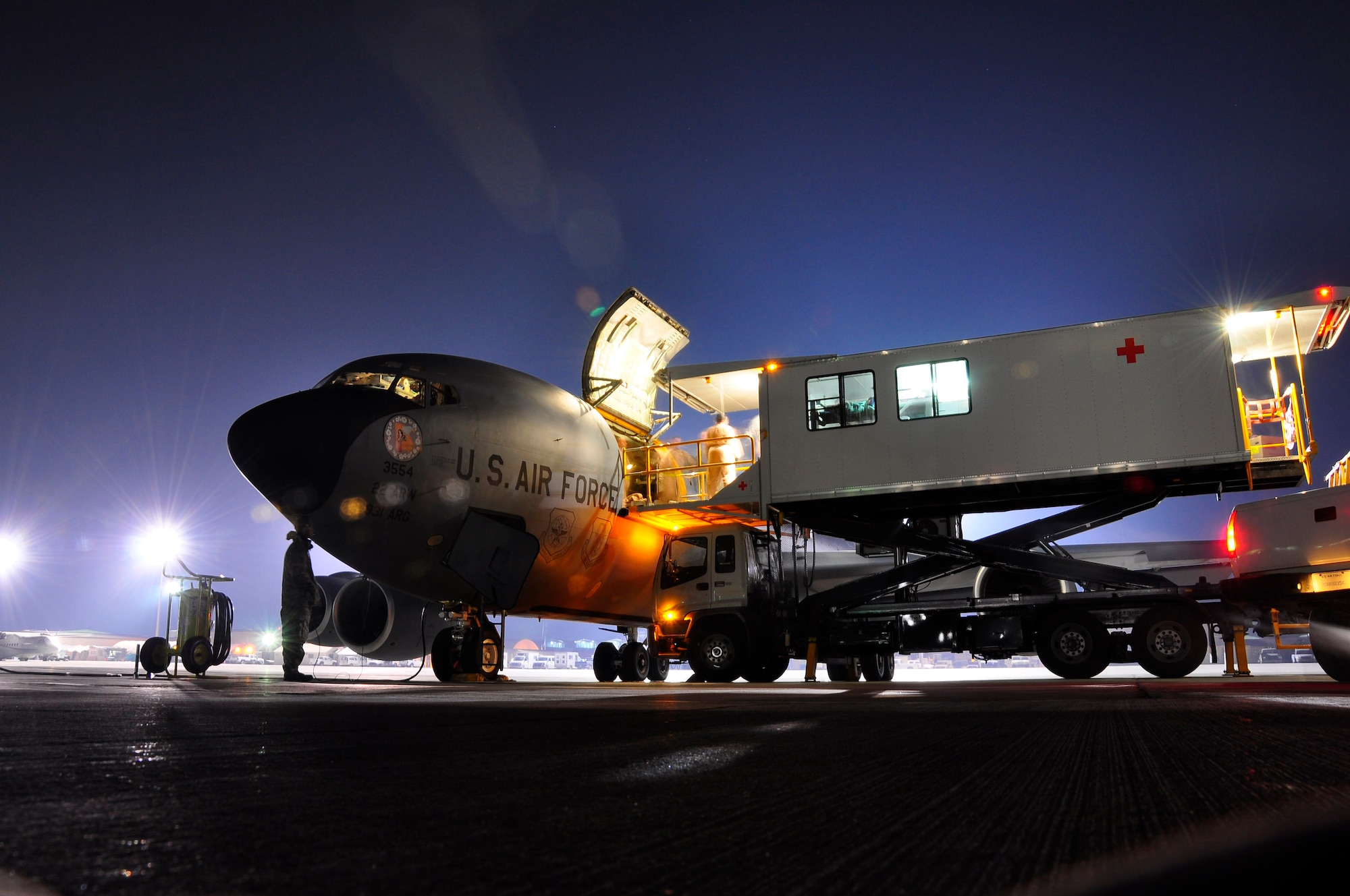 Sick and wounded troops are taken from a specialized transport vehicle onto a KC-135 Stratotanker at Bagram Airfield, Afghanistan. The KC-135 was manned by Airmen from the 931st Air Refueling Group who volunteered for a 12-day aeromedical evacuation mission that included four trips from Germany to Afghanistan. The 931st ARG is an Air Force Reserve unit at McConnell Air Force Base, Kan. (U.S. Air Force photo/Lt. Col. Tyoshi Tung)
