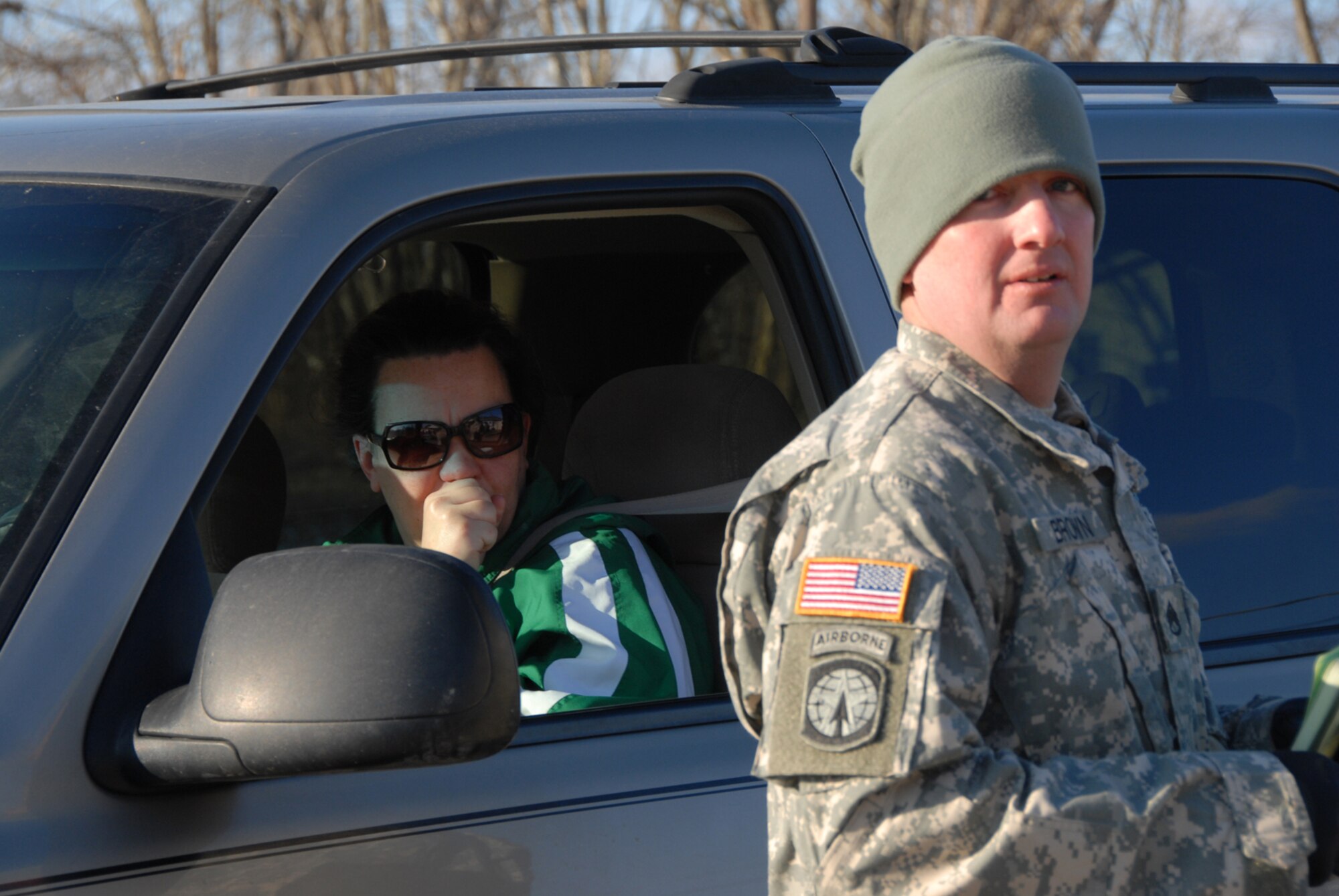 Kentucky Army National Guard member, SSgt. Jimmie Brown, Bravo Battery, from Campbellville, Kentucky.  Assist local resident Shelly Chandler of Wickliffe, Kentucky.  with disaster relief supplies.