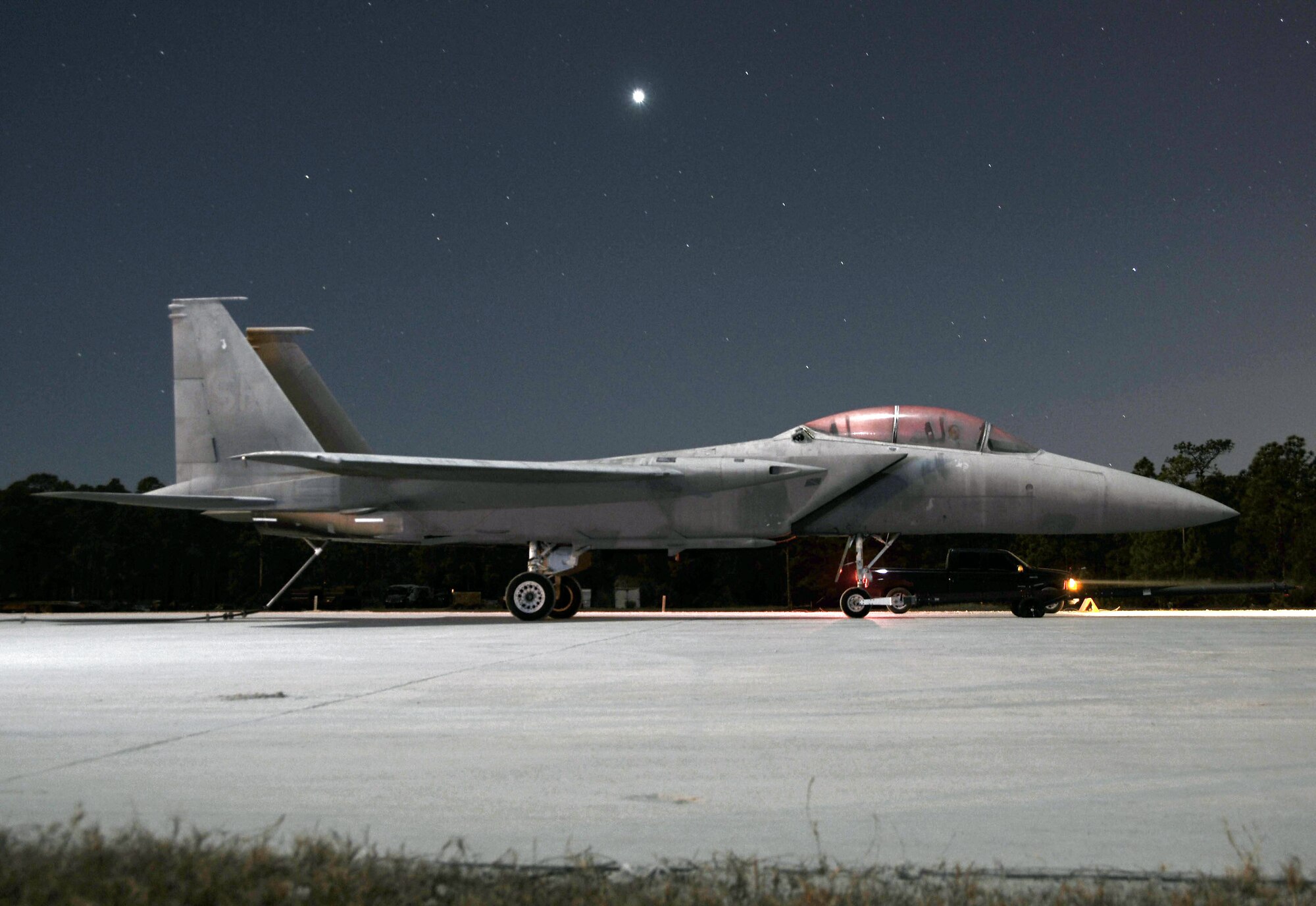 An F-15 sits on the runway after a night time barrier engagement simulation during a Silver Flag exercise Feb. 5. Silver Flag exercise is a training exercise conducted at Tyndall Air Force Base, Fla., to train military personnel within their prespective career field. (U.S. Air Force photo/Master Sgt. Mark Fortin) 
