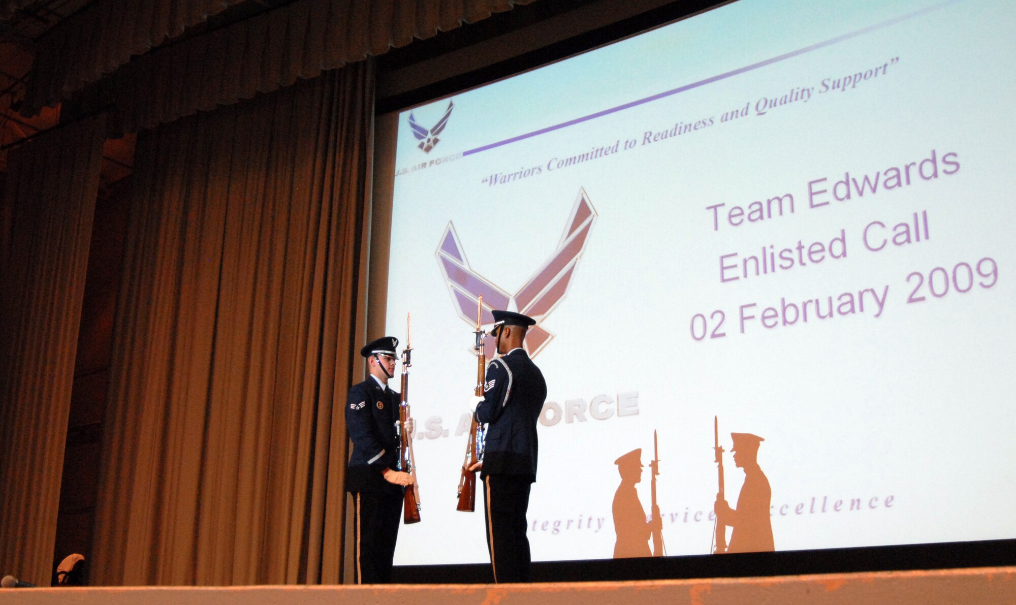 The Blue Eagles Honor Guard performs for Edwards enlisted Airmen and Marines during an enlisted call at the base theater Feb. 2. Topics such as educational opportunities on base, strategic communication, driving under the influence, physical fitness testing and dormitory updates were discussed during the enlisted call. (Air Force photo by Senior Airman Julius Delos Reyes)