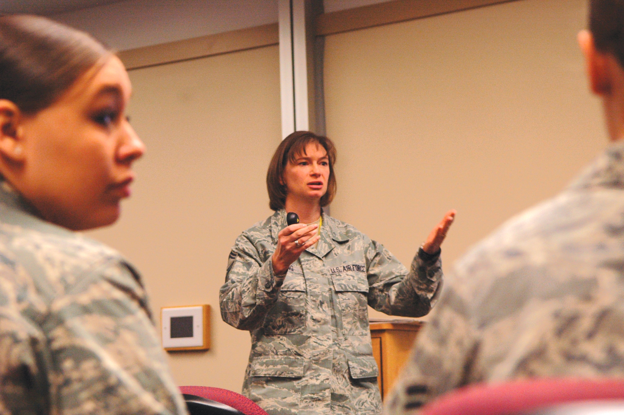 Senior Master Sgt. Bethann Fleming speaks to a group of Tinker Airmen at a newcomers briefing at the Airman and Family Readiness Center here. Sergeant Fleming and Master Sgt. Bernard Anderson are the Team Tinker career assistance advisors. Their job is to help Airmen with things such as career job reservations, base of preference and re-training. They don’t try to coerce people to stay in the Air Force, but they inform members of what their options are to help them make a better decision. (Air Force photo/Micah Garbarino)