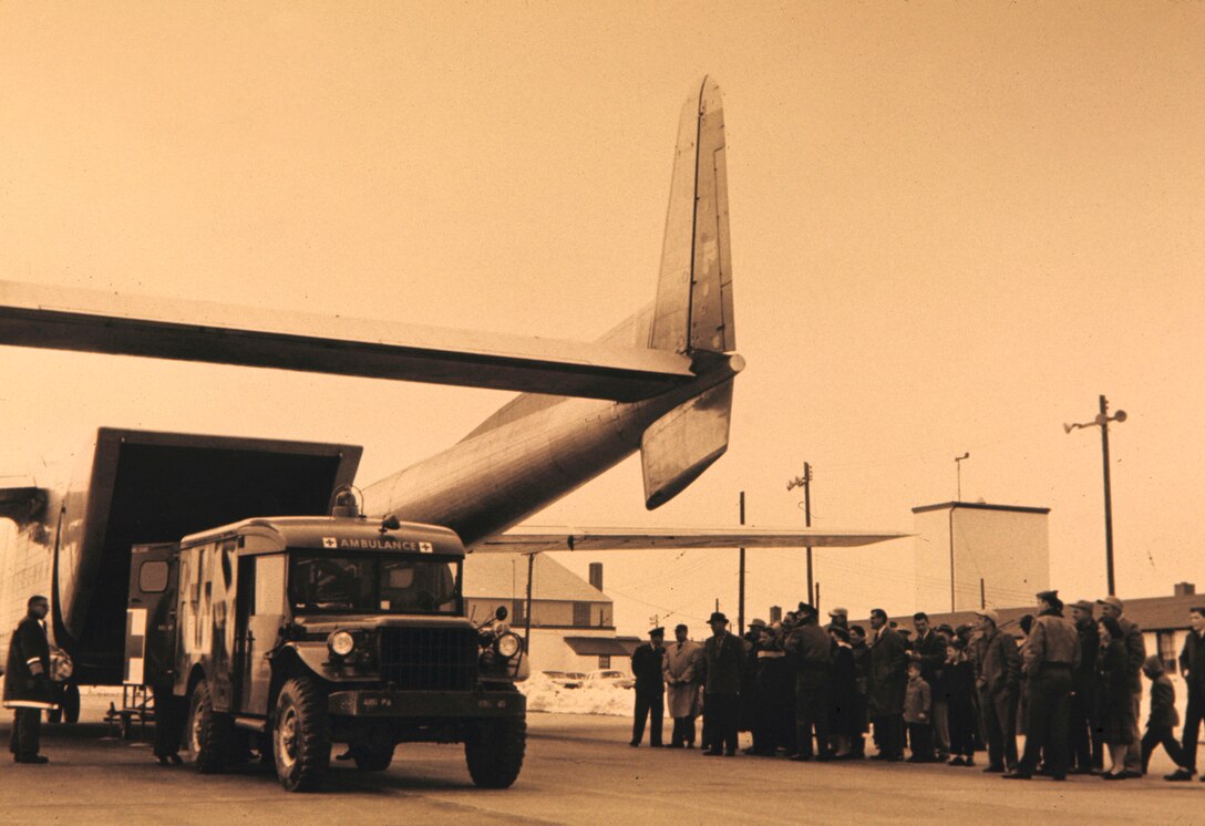 An ambulance pulls up to a C-119j "Flying Boxcar" of the 140th Aeromedical Transportation Sq. at Spaatz Field in Reading, Pa.  The C-119's were flown by the unit from April 1958 to Nov. 1962.  The transition to Middletown took place in February 1961.  We are looking for any identification in this image, please contact 193SOW Public Affairs with any information for identification where, when, who, how or why by sending an email to pa.193sow@paharr.ang.af.mil.