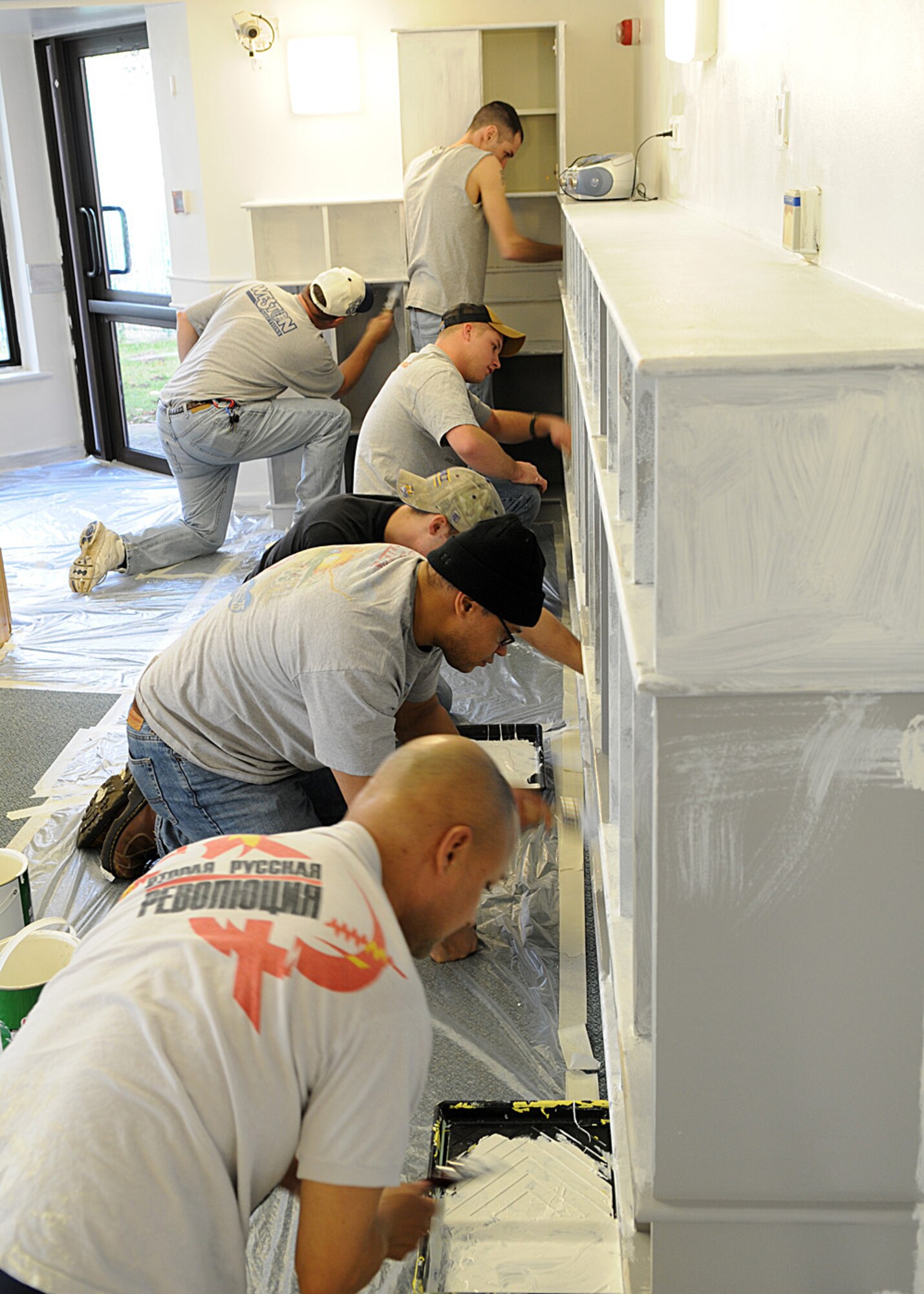 Several Airmen from the 100th Logistics Readiness Squadron, volunteered their weekend to help paint room 114 at the Child Development Center Jan. 17, 2009, at RAF Mildenhall, England. The remodeling efforts involved sanding and painting the entire room to brighter colors to offer children a comfortable and playful environment. (U.S. Air Force photo by Staff Sgt. Jerry Fleshman)