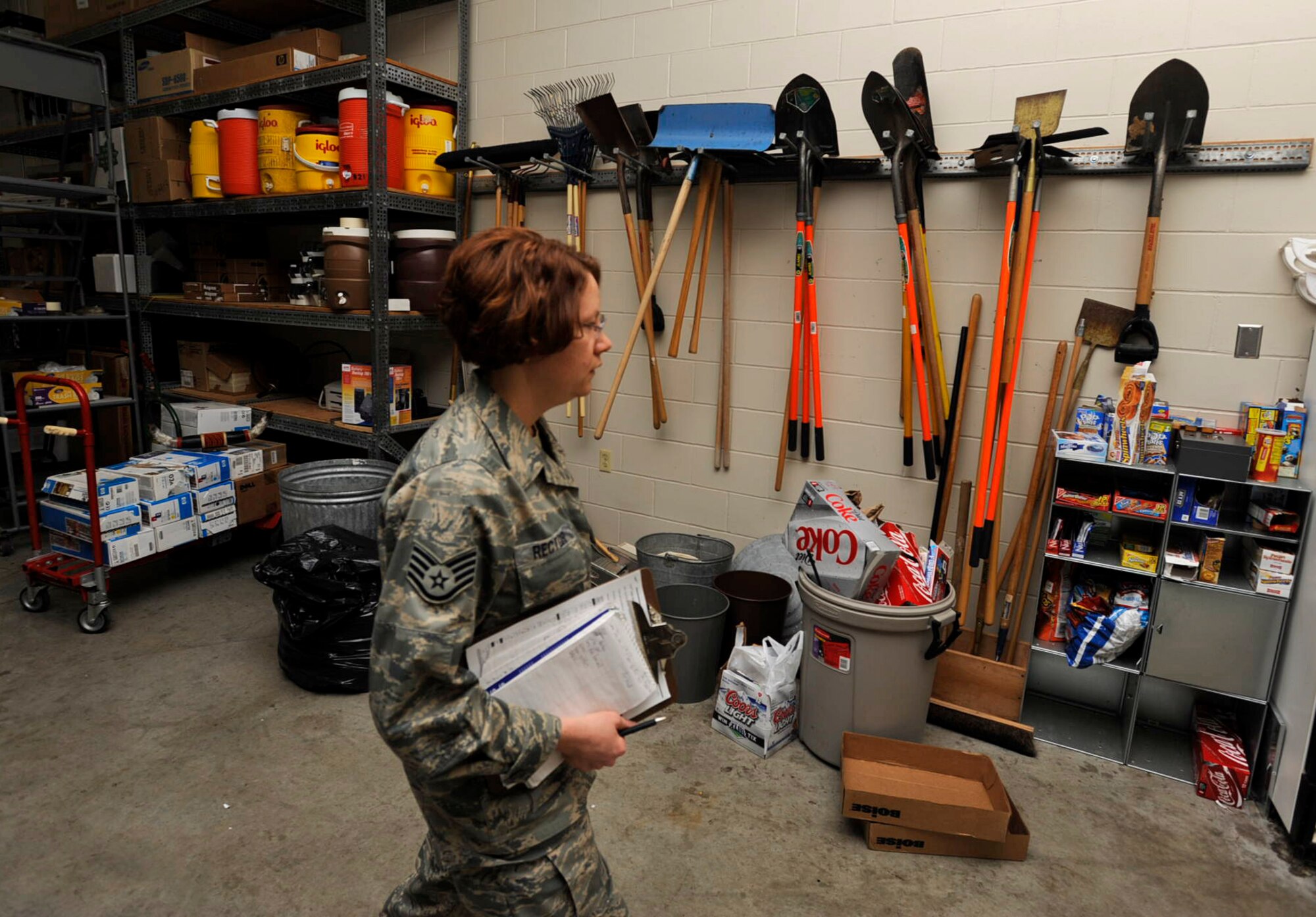 Staff Sgt. Regina Rector inspects a storage area of the 931st Civil Engineer Squadron for any potential safety hazards. A team of inspectors are scheduled to arrive at McConnell Air Force Base, Kan., Friday to begin a four-day evaluation of the 931st Air Refueling Group's safety programs. Sergeant Rector is the superintendent of safety for the 931st, an Air Force Reserve unit at McConnell. (U.S. Air Force photo/Tech. Sgt. Jason Schaap)   