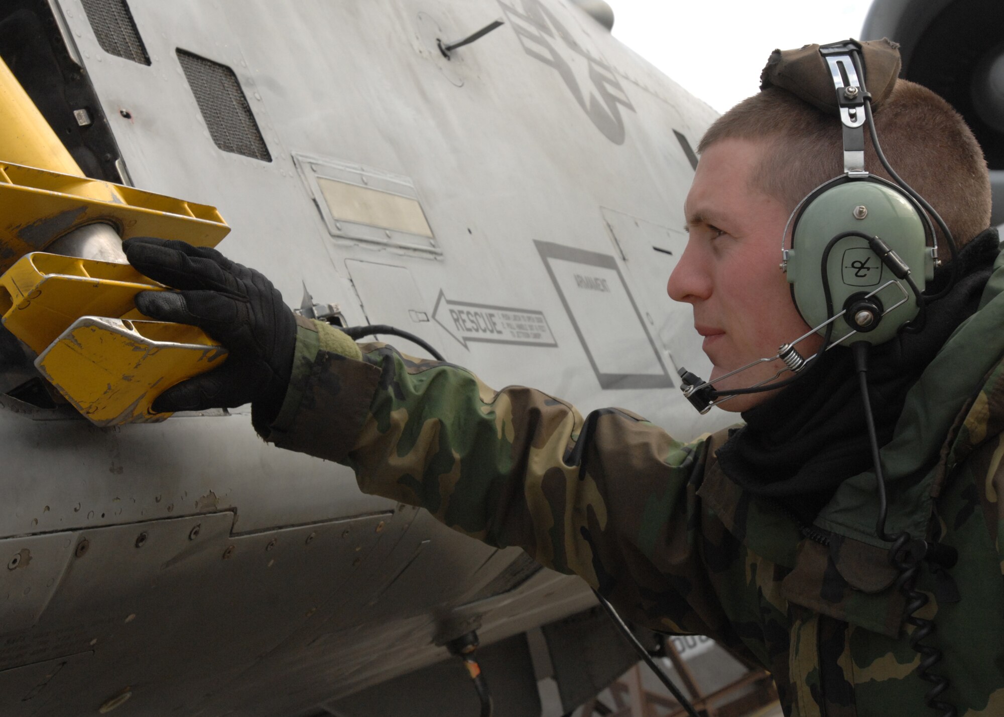 SPANGDAHLEM AIR BASE, Germany -- Senior Airman Ryan Daschofsky, 52nd Air Maintenance Squadron, stores a ladder on an A-10 Warthog Jan. 28, 2009. A routine pre-flight inspection is completed prior to the launch of the aircraft. (U.S. Air Force photo by Senior Airman Jenifer H. Calhoun)