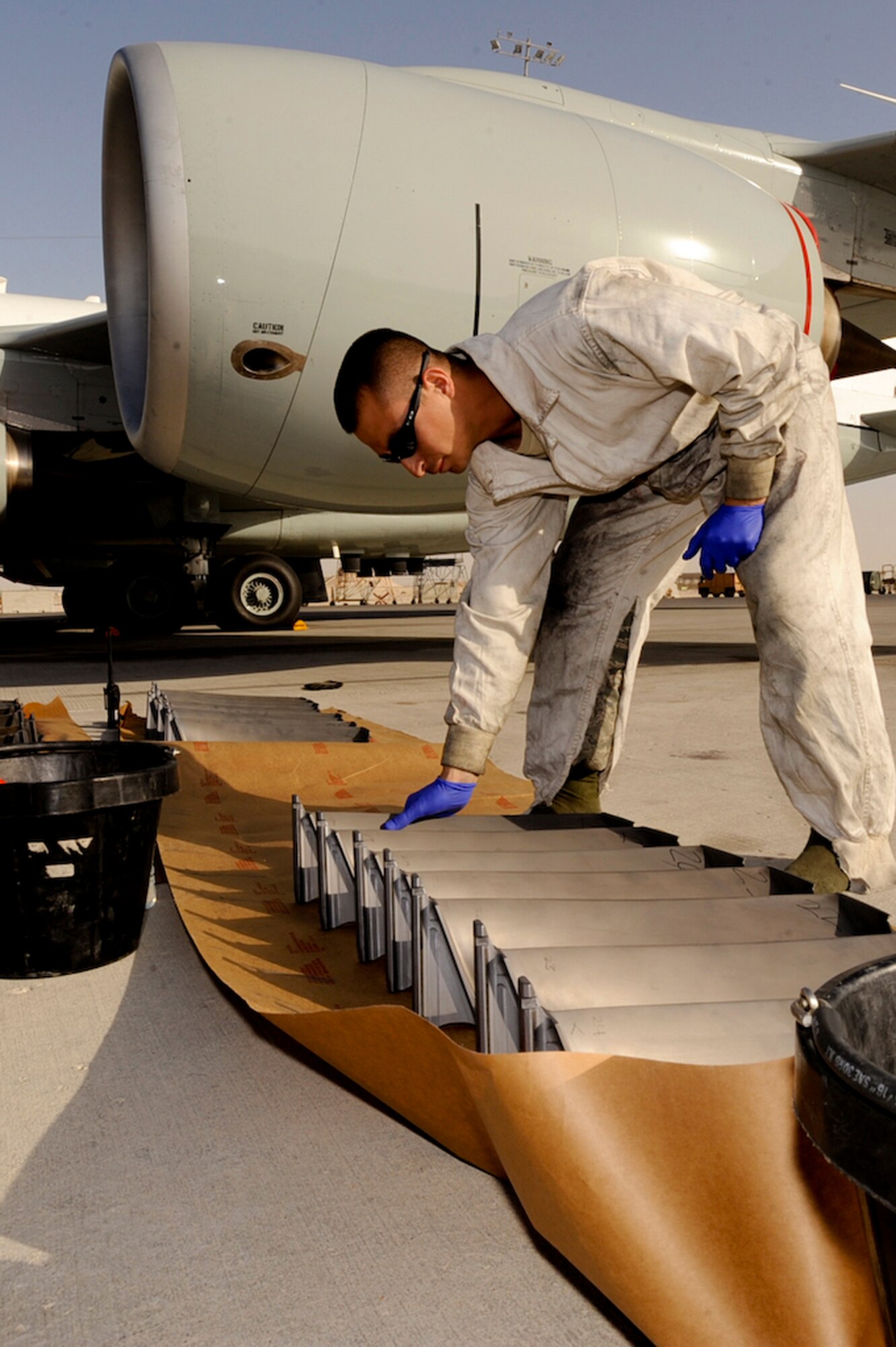 Senior Airman Frank Johnstone, a jet engine mechanic with the 55th Aircraft Maintenance Unit, preps engine fan blades from an RC-135 Rivet Joint surveillance aircraft for a 1500 hour inspection, Feb. 5, 2009, in an undisclosed location in Southwest Asia.  Preventive maintenance is performed to ensure the aircraft is mission ready and is able to provide near real time, on-scene intelligence collection, analysis and dissemination of acquired information.   Airman Johnstone is originally from San Benito, Texas and deployed from Offutt Air Force Base, Neb. in support of Operations Iraqi and Enduring Freedom and Combined Joint Task Force - Horn of Africa.  (U.S. Air Force Photo by Staff Sgt. Joshua Garcia/released)